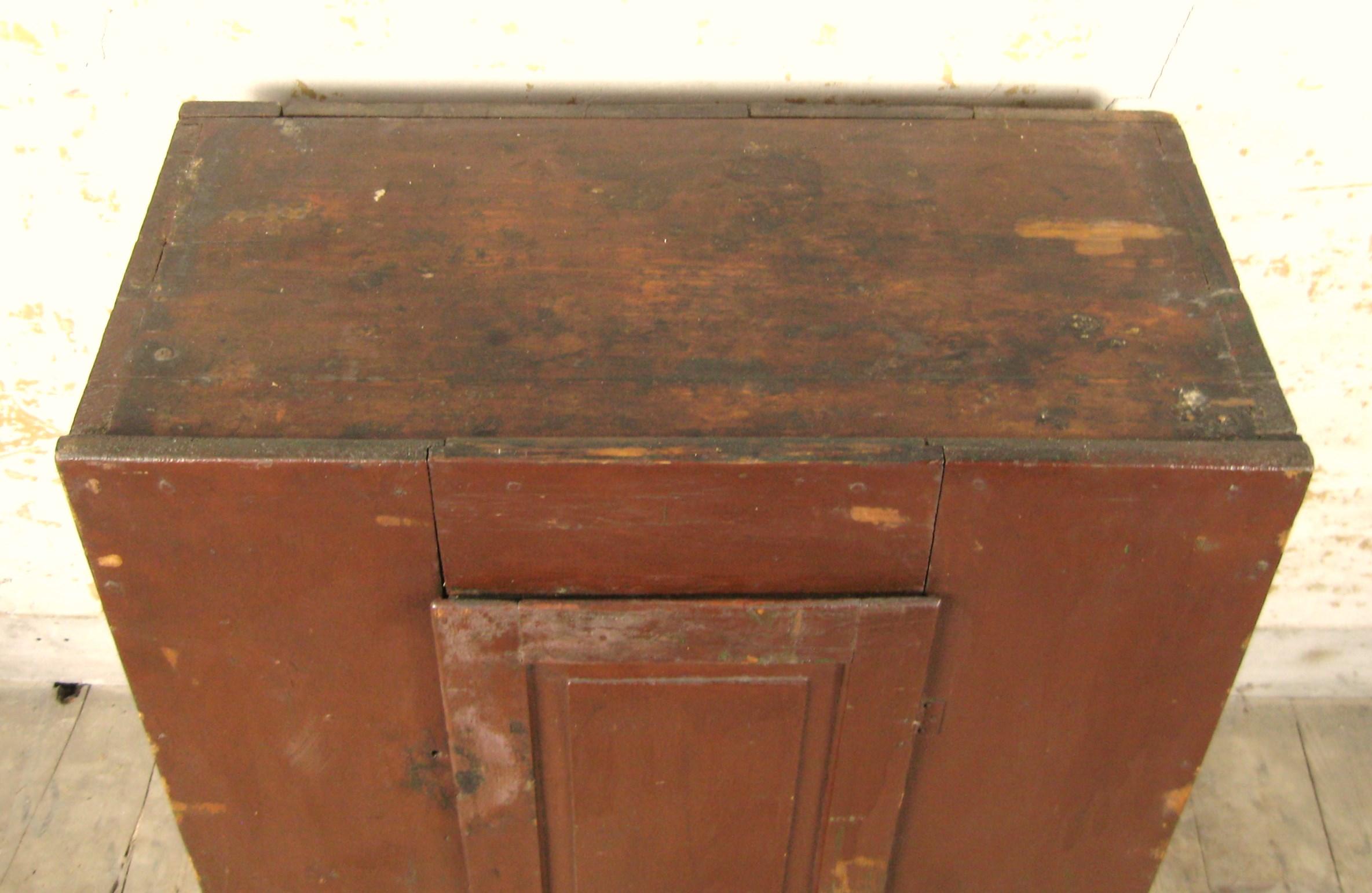 Hand-Crafted 19th Century Brown / Red Primitive Blind 1 door painted cupboard For Sale