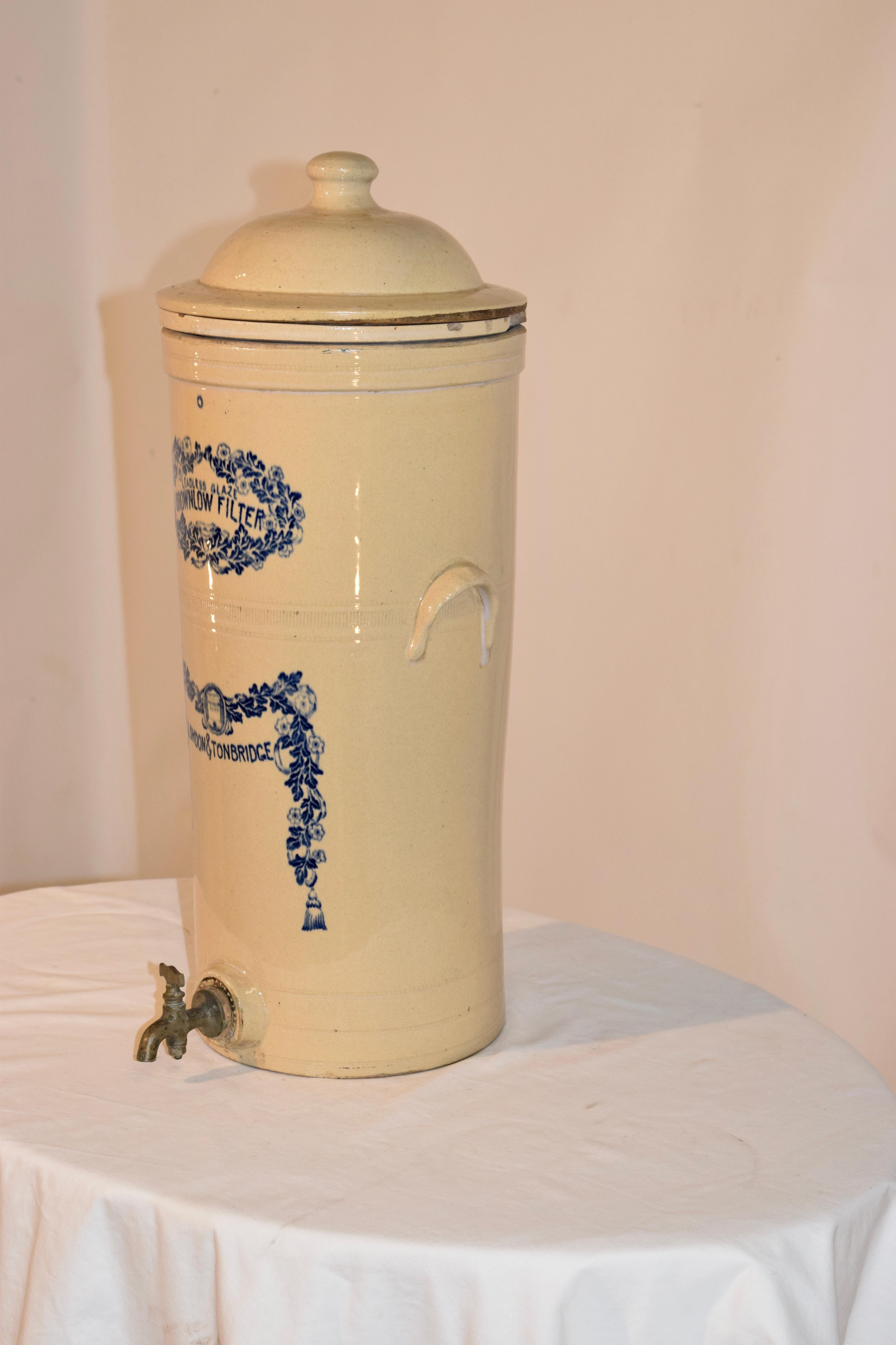 19th century English stoneware water filter. The stoneware is brown glazed and has blue transfer of 