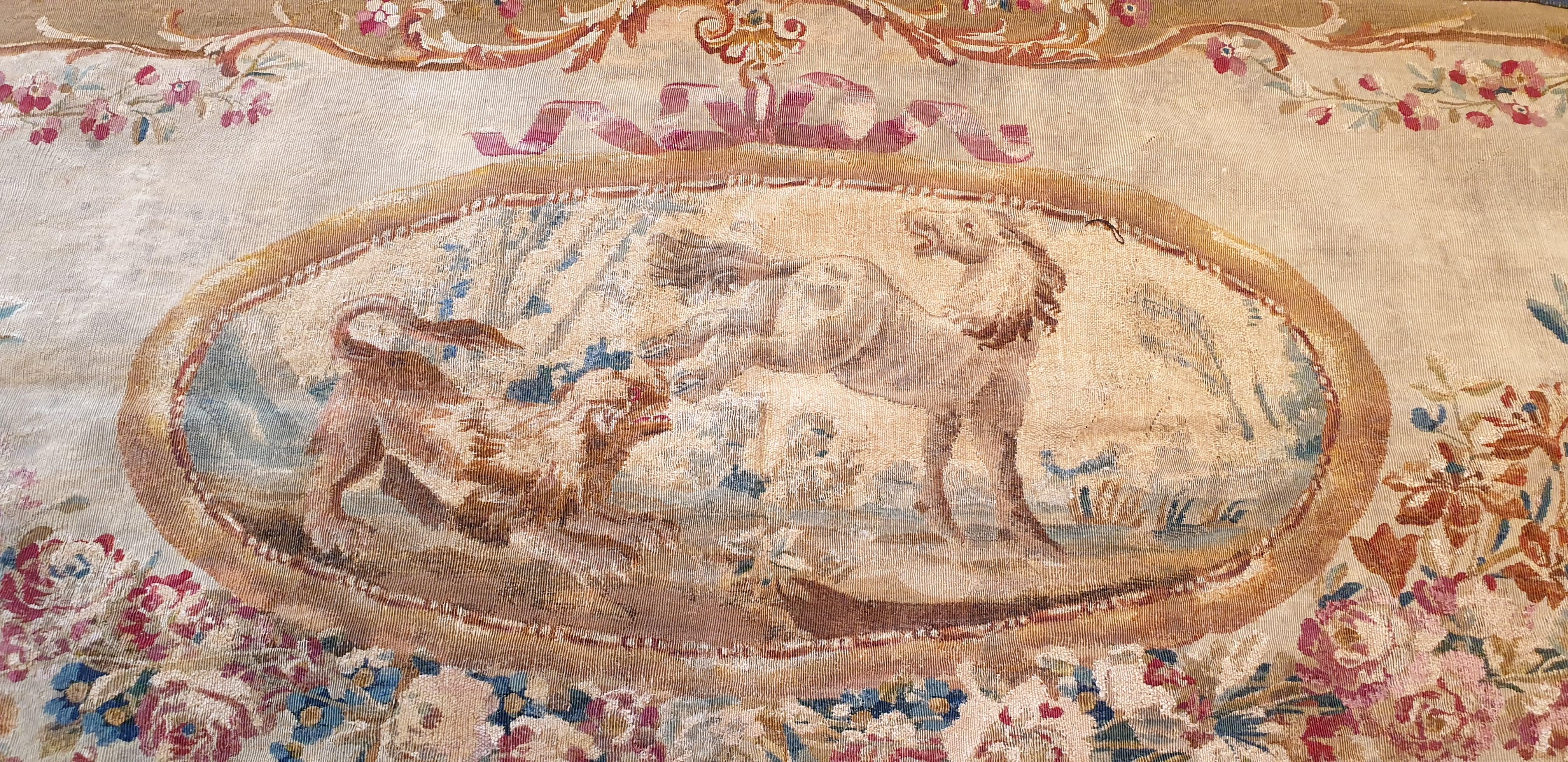 Brussels tapestry handwoven in the 18th century. Representation of a wolf attacking a horse.
Contour of flowers and ornaments. 
Oval shape. Reinforcement by a fabric on the back of the work.
Perfect state of conservation 

Measures:
W 69.29 in. x H