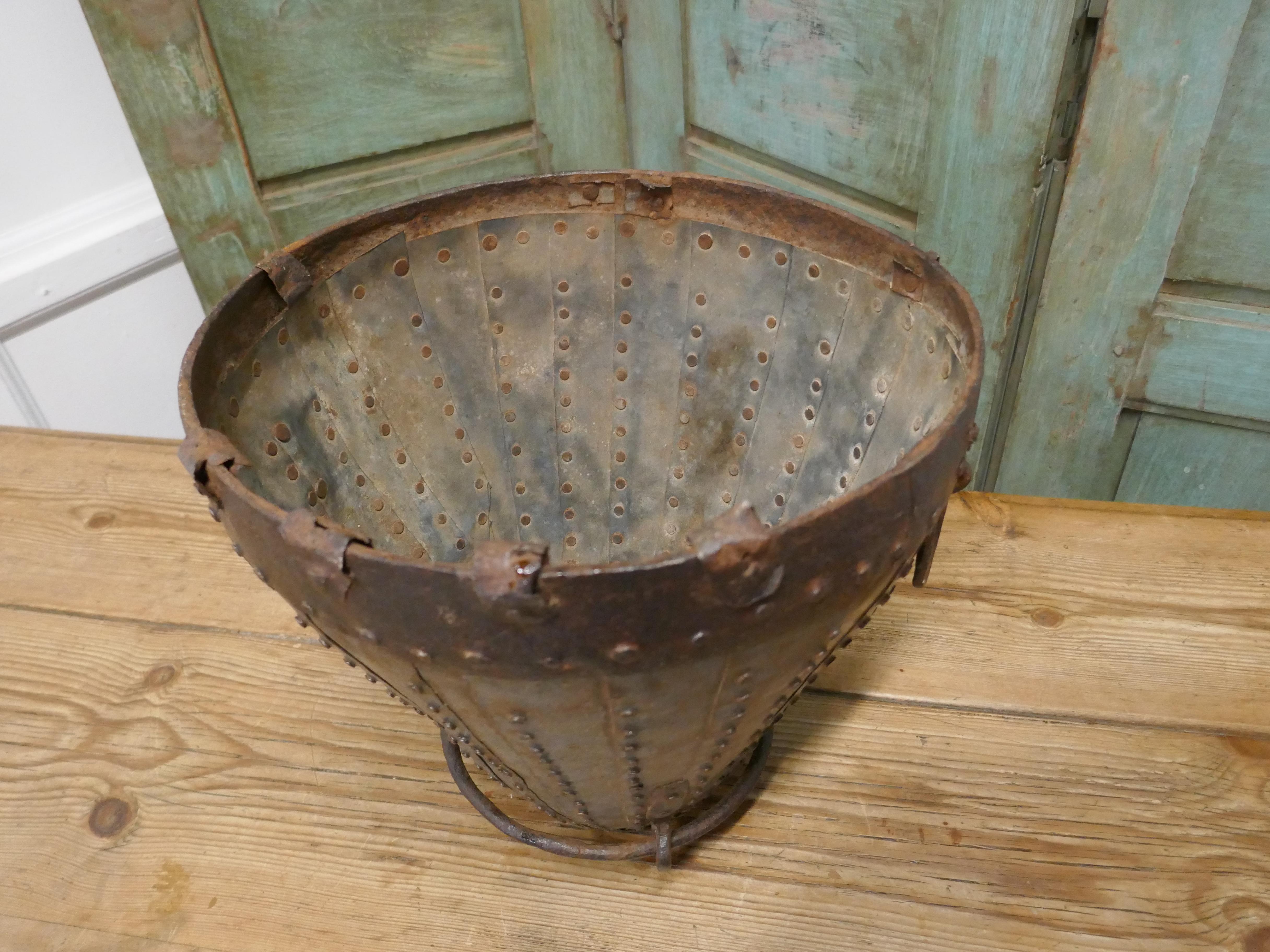 19th century Brutalist North African water bucket

Stud and riveted water bucket from North Africa

An amazing piece, the main body is made up with layered riveted strips of metal, there is an Iron top rim and bottom, ring handles and lower