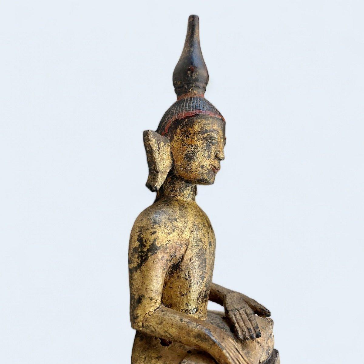 We present you this unique and wonderful seated Buddha from Laos, dating back to the early 19th century or possibly earlier. It depicts the wandering ascetic and religious teacher in meditation, clad in monk's attire, his visage radiating deep inner