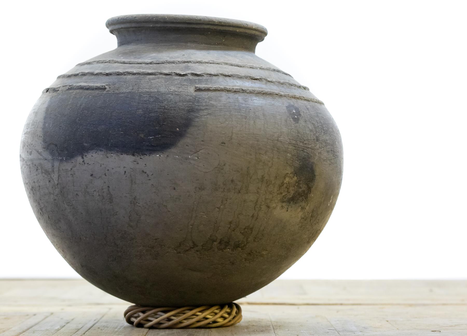 A lovely squat and bulbous African earthenware / clay storage jar.