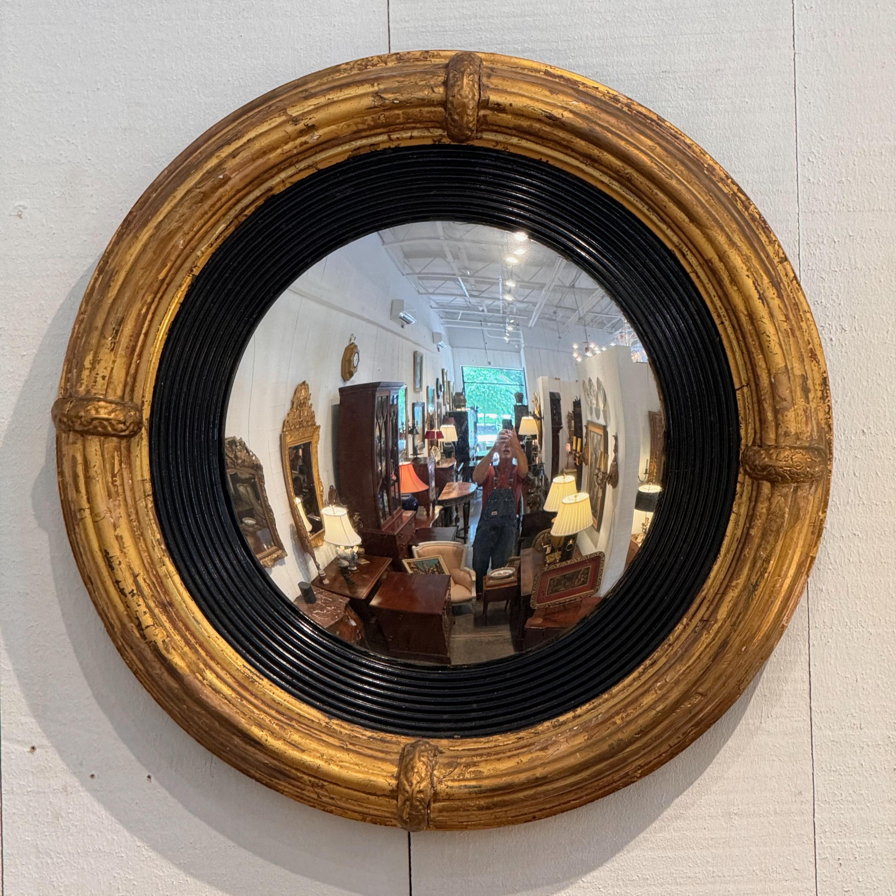 A bulls eye mirror opens up a room. Reflects all around.