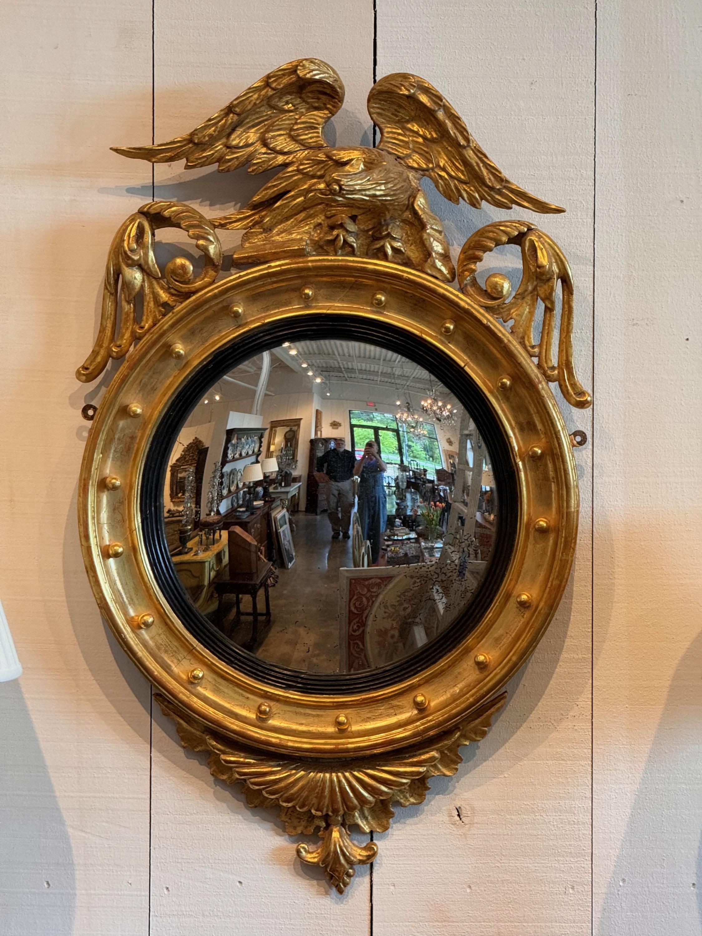An impressive bullseye mirror. Great gilding and carving..
