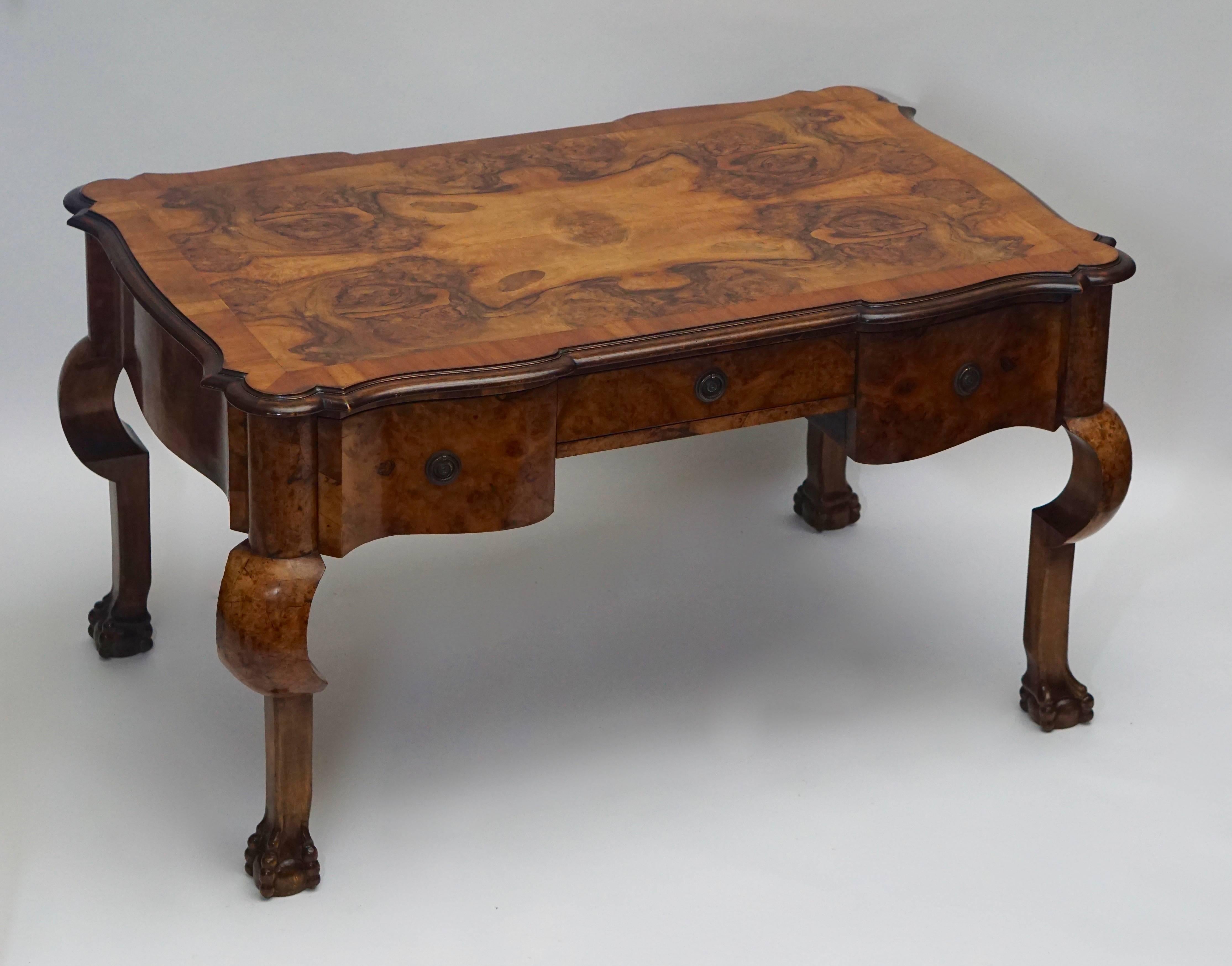 Magnificent 19th century burled walnut partners desk with original armchair and claw legs.

19th century burl walnut partners writing desk with armchair. This desk has functional curved drawers on both sides, a true partner's desk. This desk is