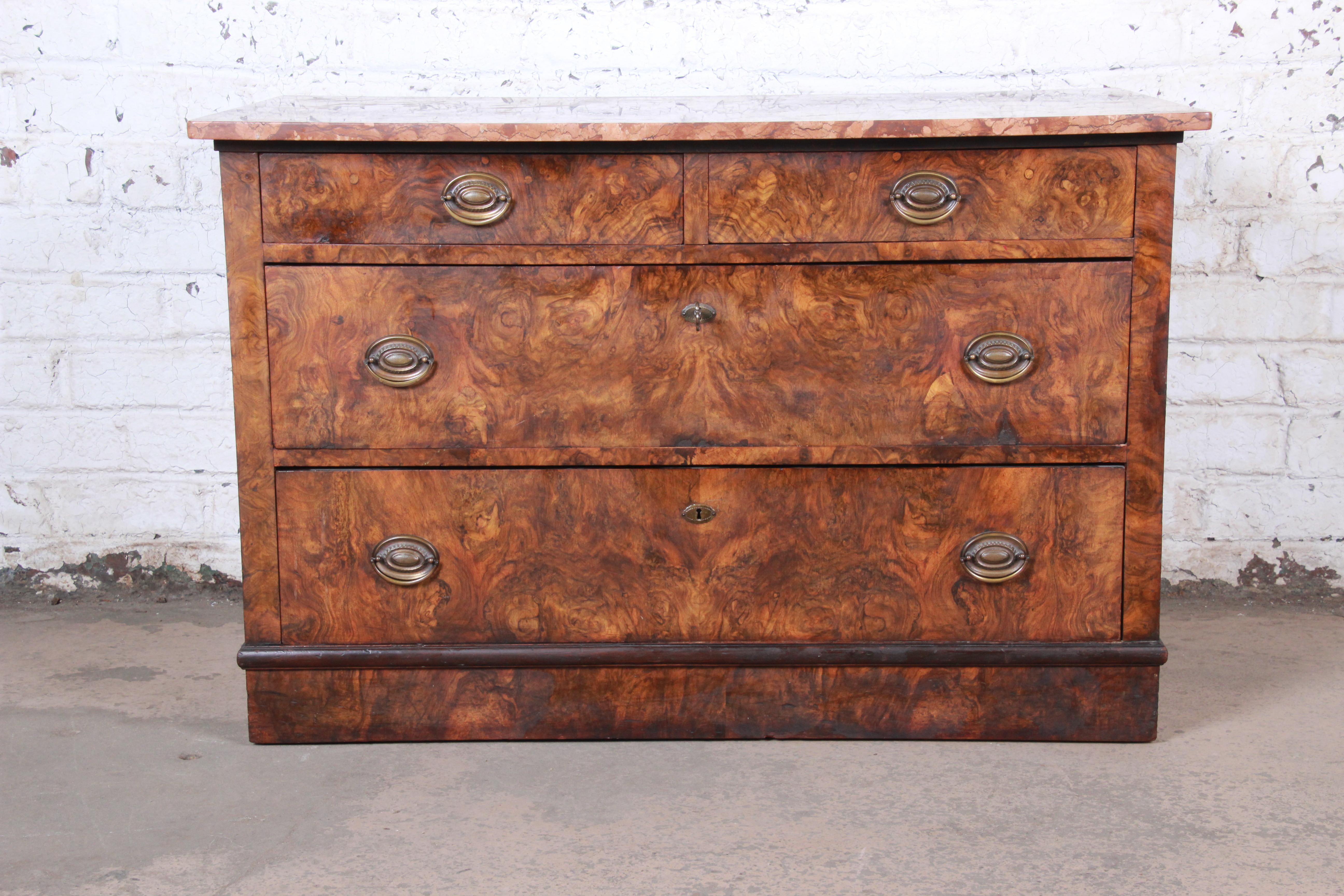 A gorgeous antique burled walnut marble top commode or dresser chest

USA, circa 1880s

Burled walnut, marble and brass

Measures: 45.38