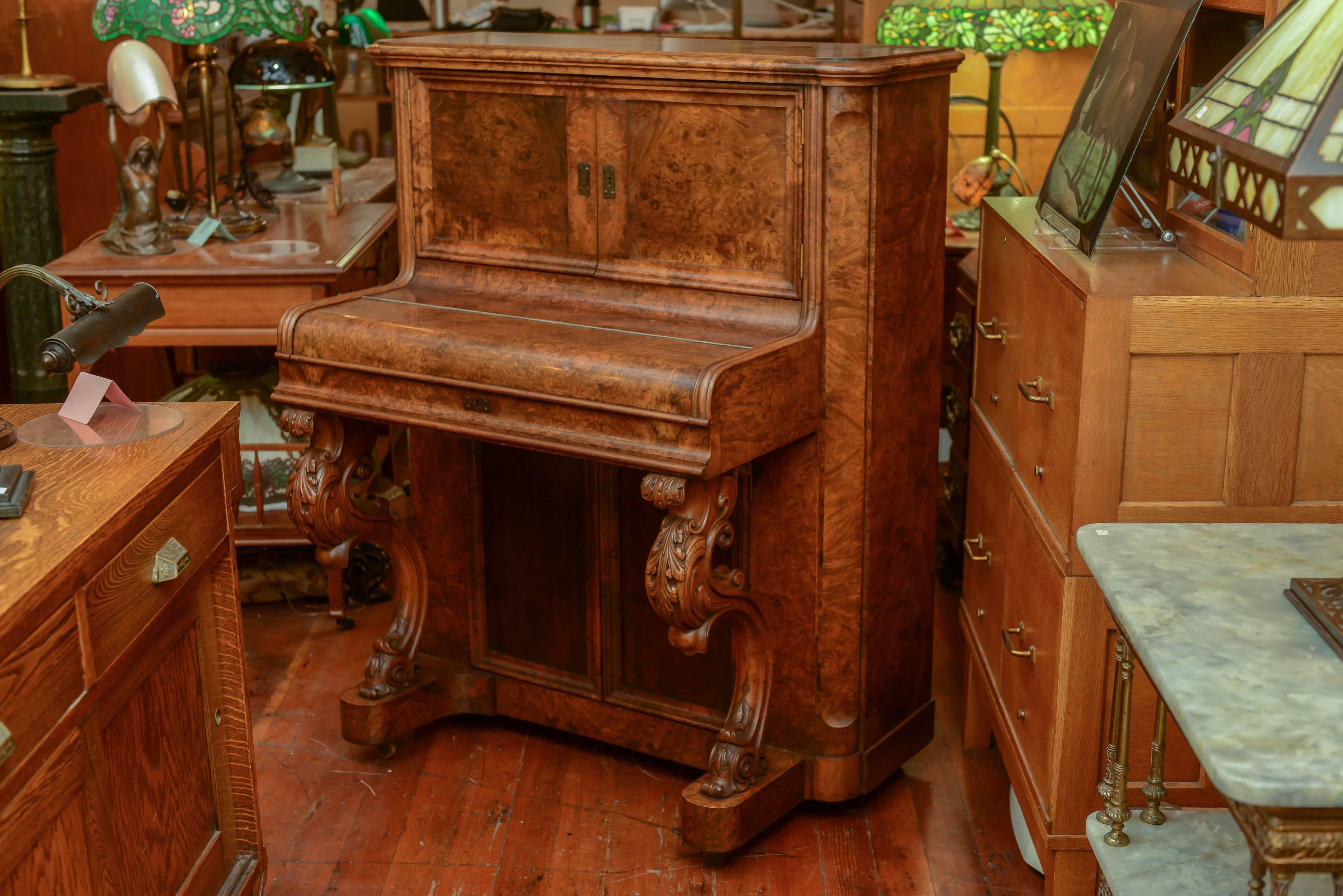 Yes, that's correct, this is a desk that closely resemble a spinet piano, however this was always a desk. The burl walnut wood just could not be any more rich and beautiful. The finish to the wood is like glass. The condition is that good. As you