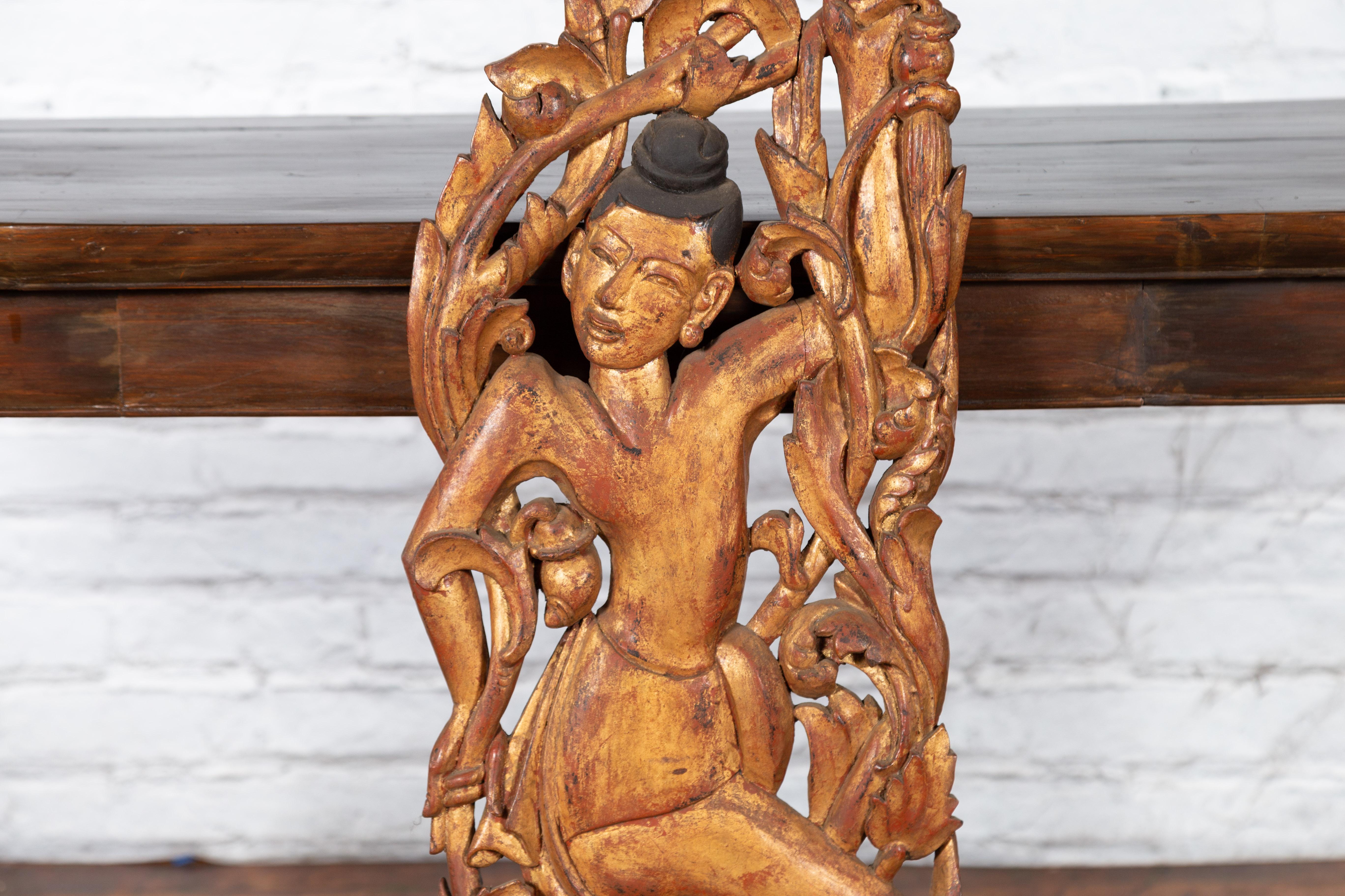 Wood 19th Century Burmese Carved Giltwood Fragment Depicting a Dancer with Foliage For Sale