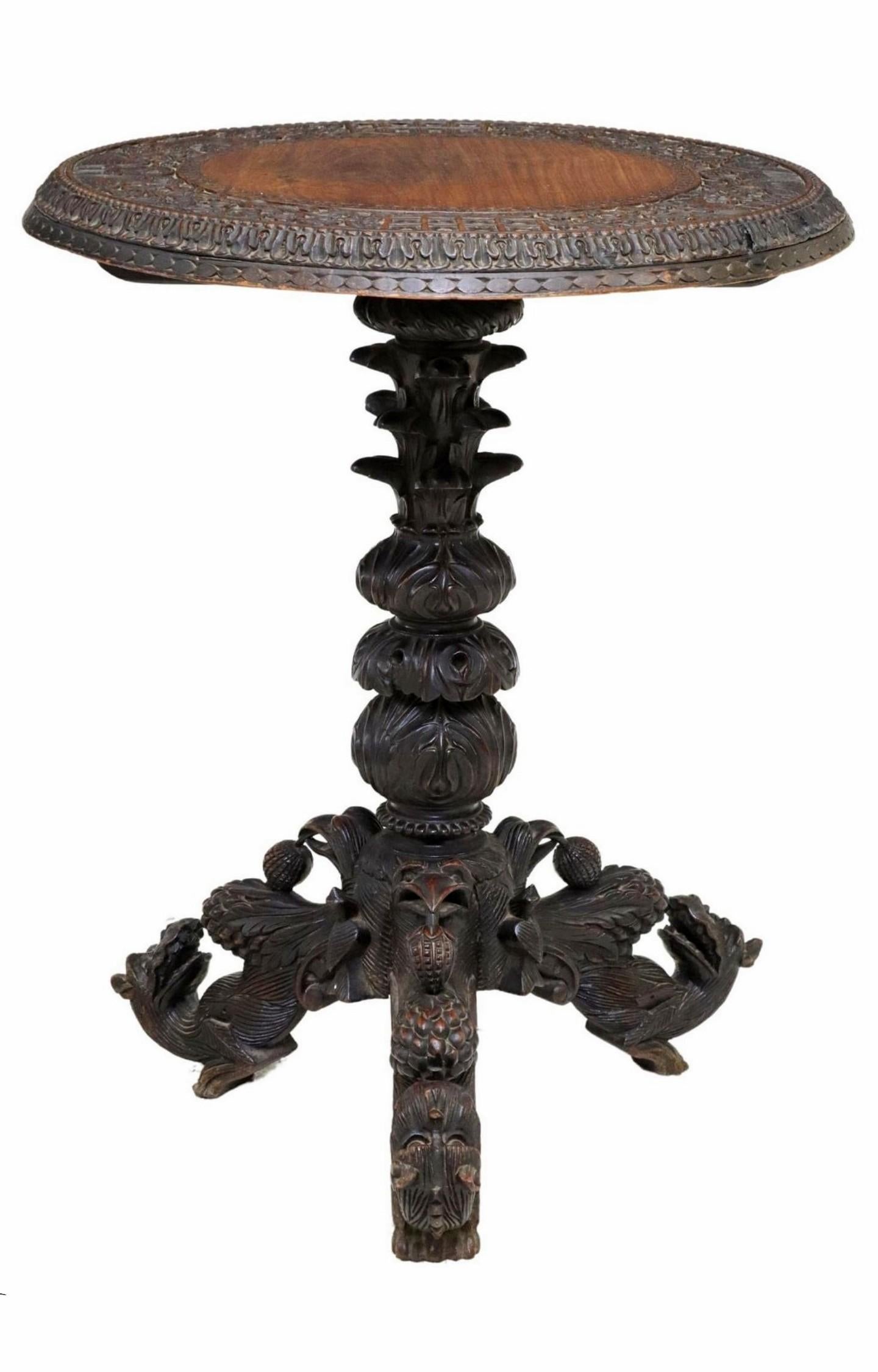 A rare and most impressive antique Burmese hand-carved hardwood side table. circa 1880

Exquisitely hand-crafted in Burma (present day Myanmar) in the late 19th century, traditional Southeast Asian Mandalay taste with heavy Anglo-Indian British