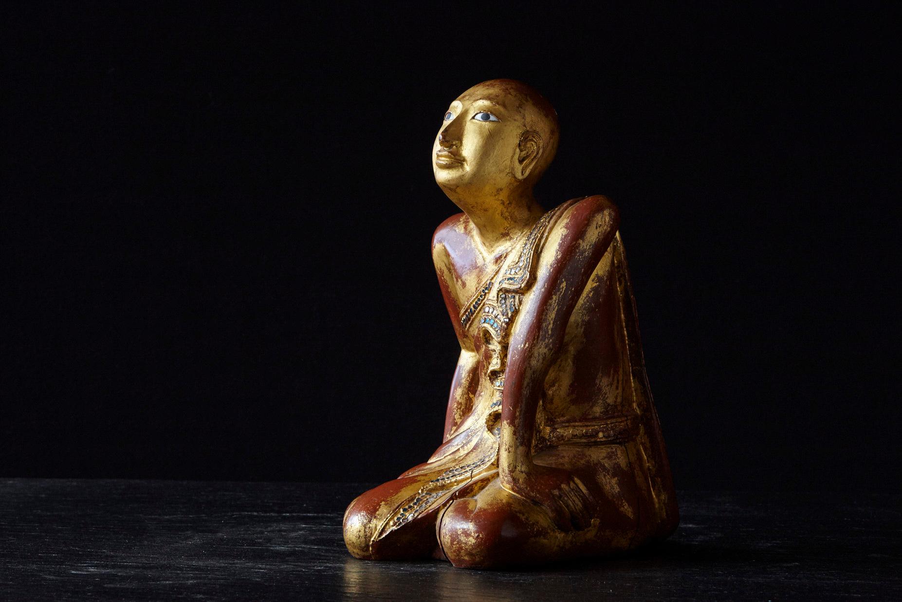 kneeling monk