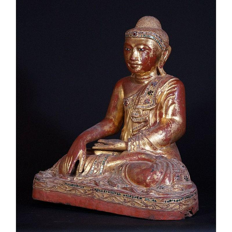 Material: wood
40 cm high 
36,5 cm wide & 23 cm deep
Weight: 5.9 kgs
Gilded with 24 krt. gold
Mandalay style
Bhumisparsha mudra
Originating from Burma
19th century

