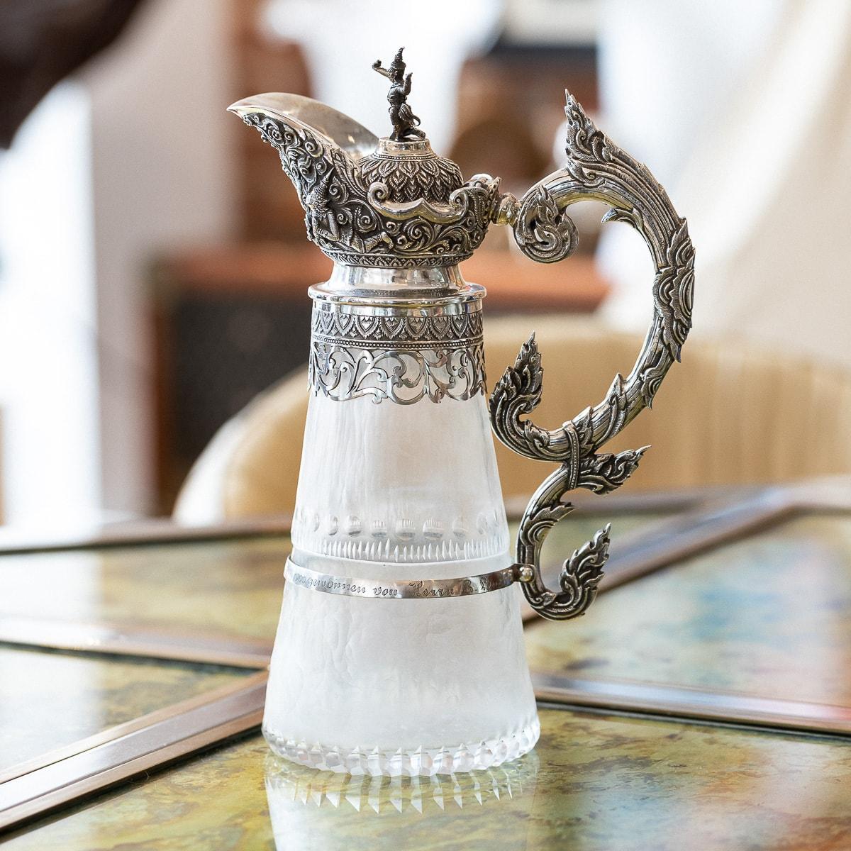 Antique late 19th Century Exceptional Burmese, (Myanmar) solid silver mounted on frosted glass wine jug, the silver mounts repousse' decorated in high relief depicting characters from the Burmese mythology, large reclining detailed deity figures set