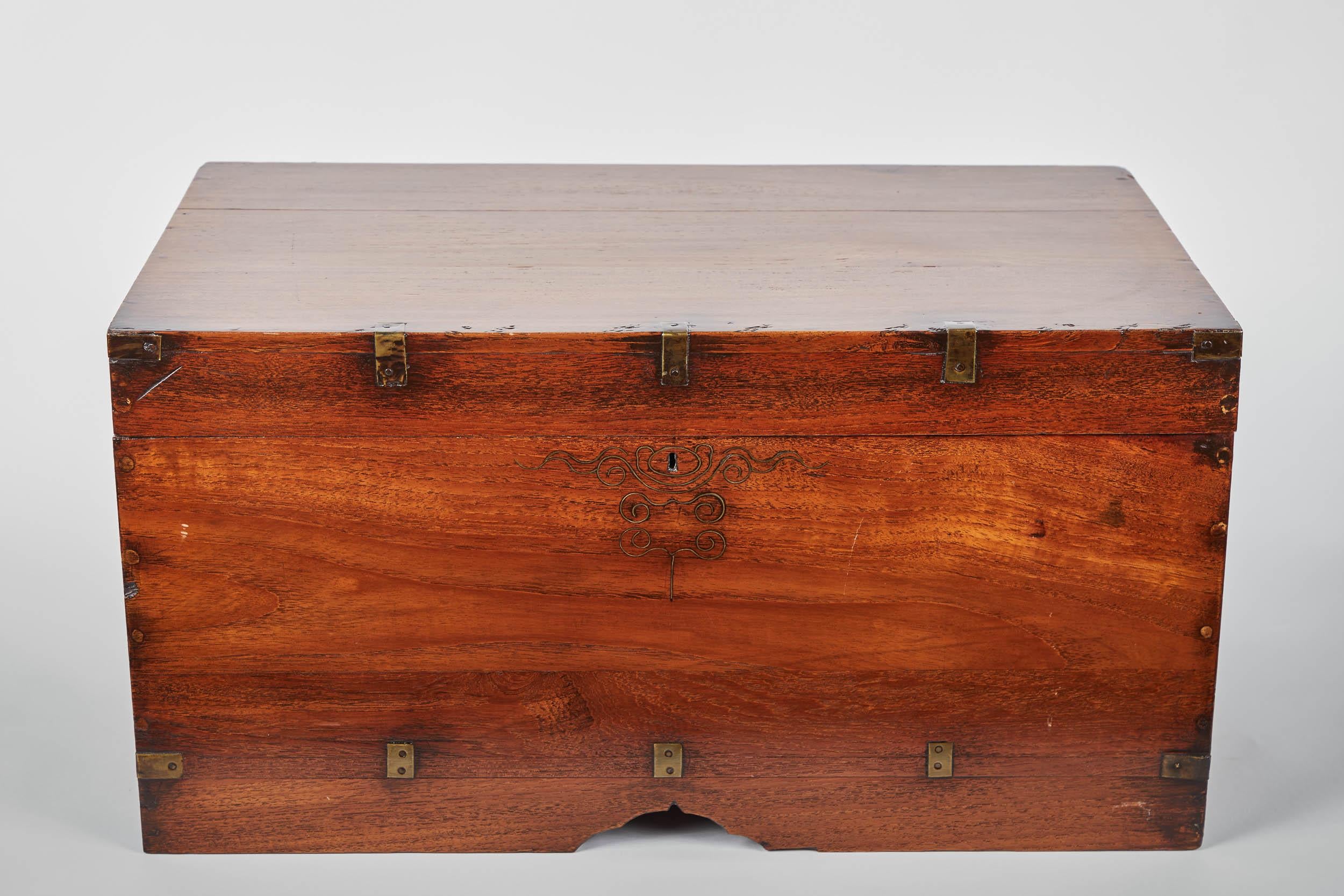 A lovely 19th century Burmese teak trunk in great condition. Gorgeous detailing inside and out, with two handles and inlay details.