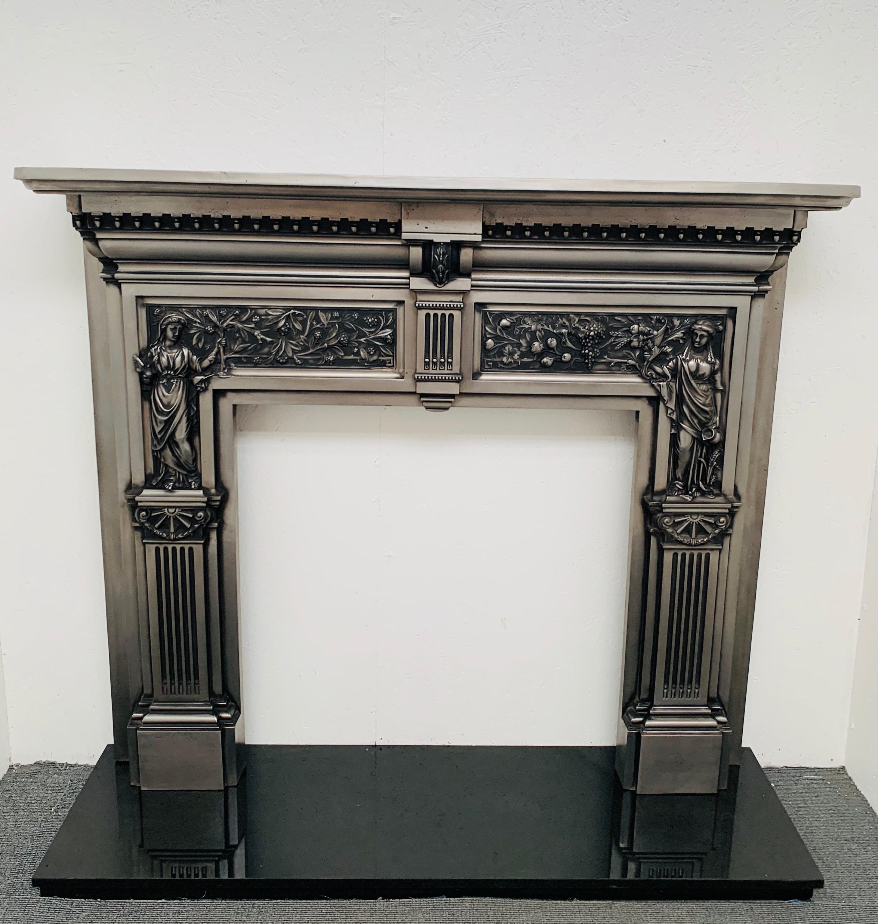 This truly magnificent original peace and plenty fireplace mantelpiece exemplifies the craftmans approach to quality iron casting of its age. This ornate period design incorporates two classic allegorical figures – Peace holding an olive branch and
