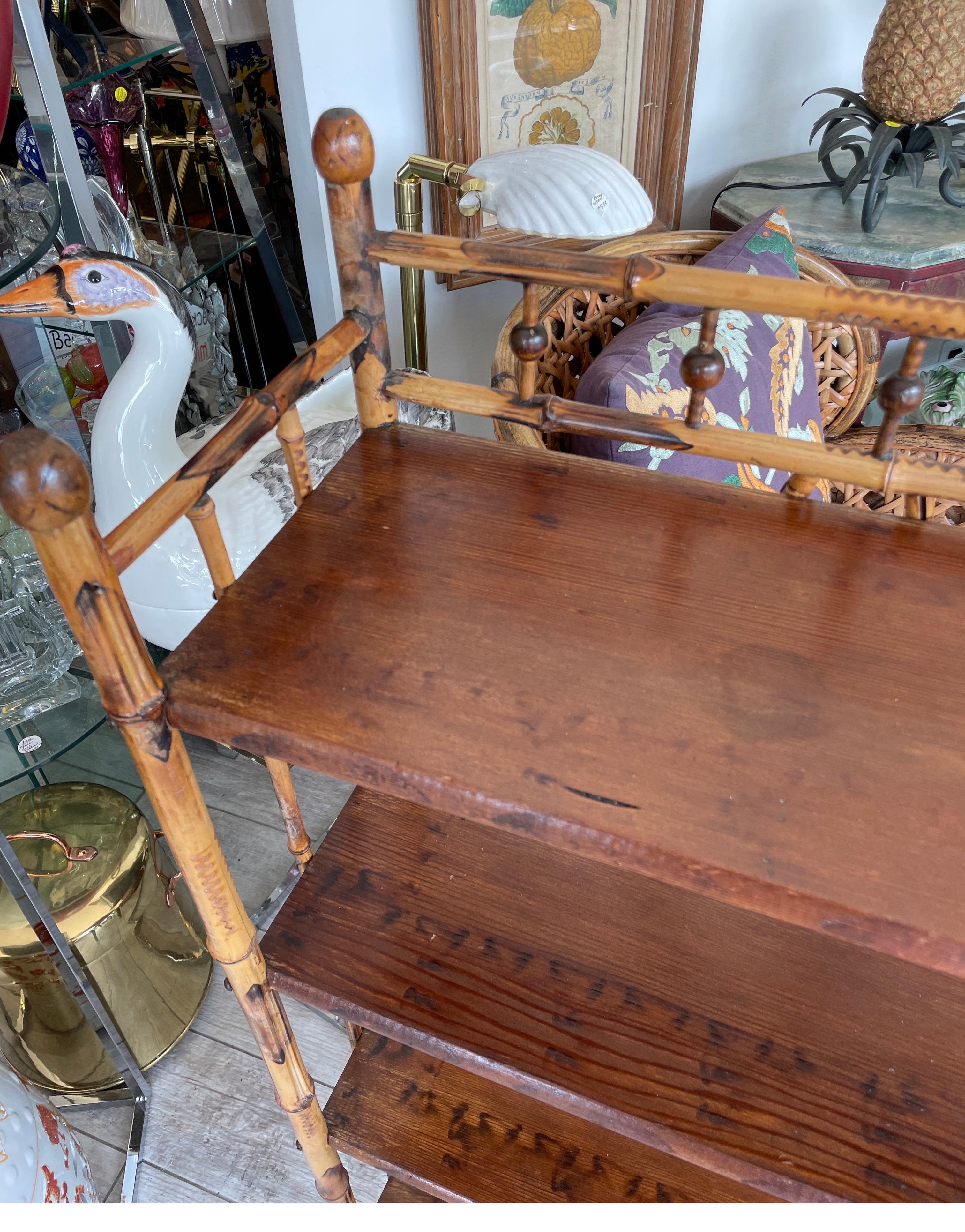 Antique four shelf burnt bamboo etagere. Constructed with bamboo sides and back with oak shelves.