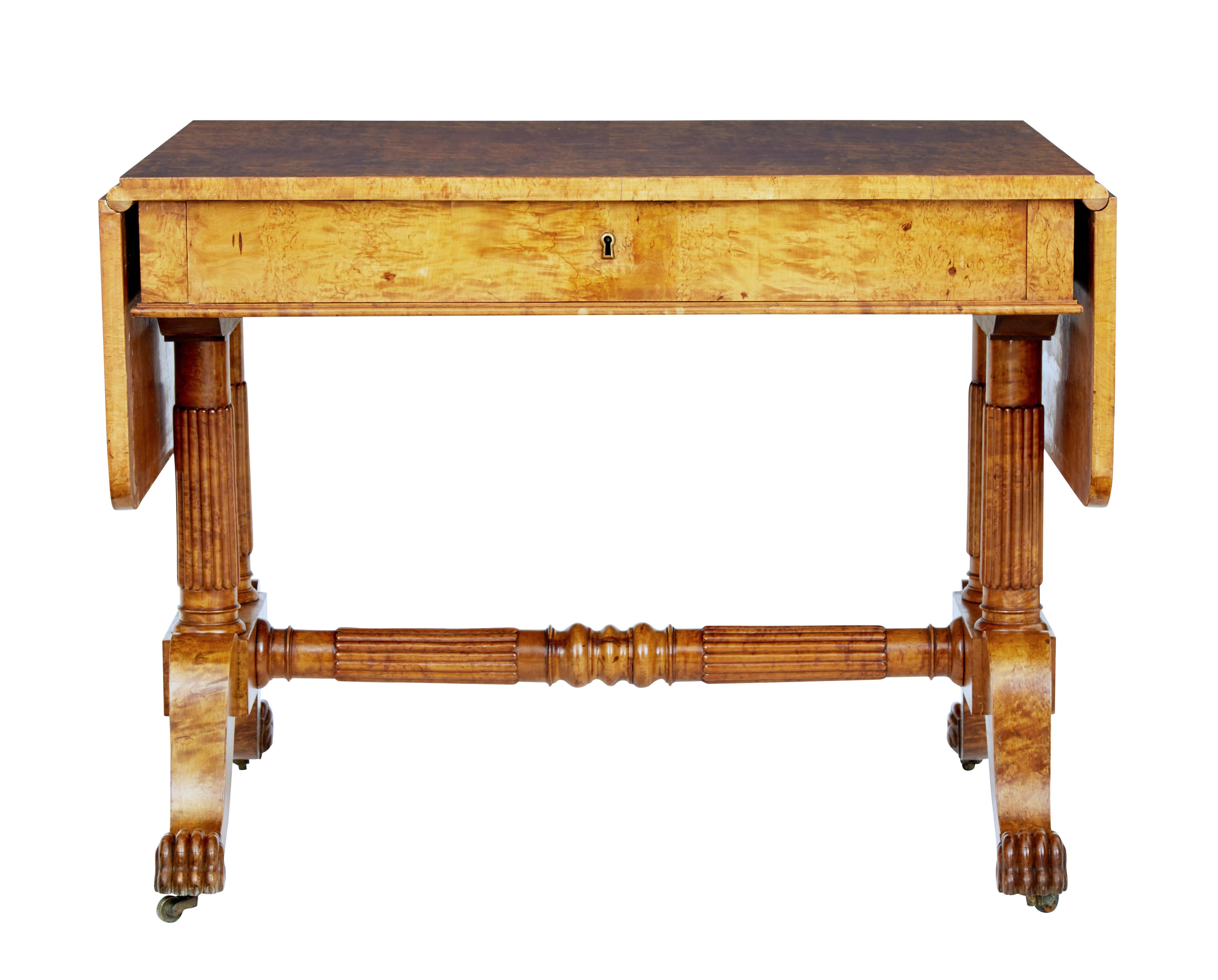 Superb quality Biedermeier period sofa table, circa 1825.

Beautifully made from burr birch, giving it strong grains and color. Drop down flaps provide a overall length of just over 63 inches.

Single deep drawer below the top surface. Standing