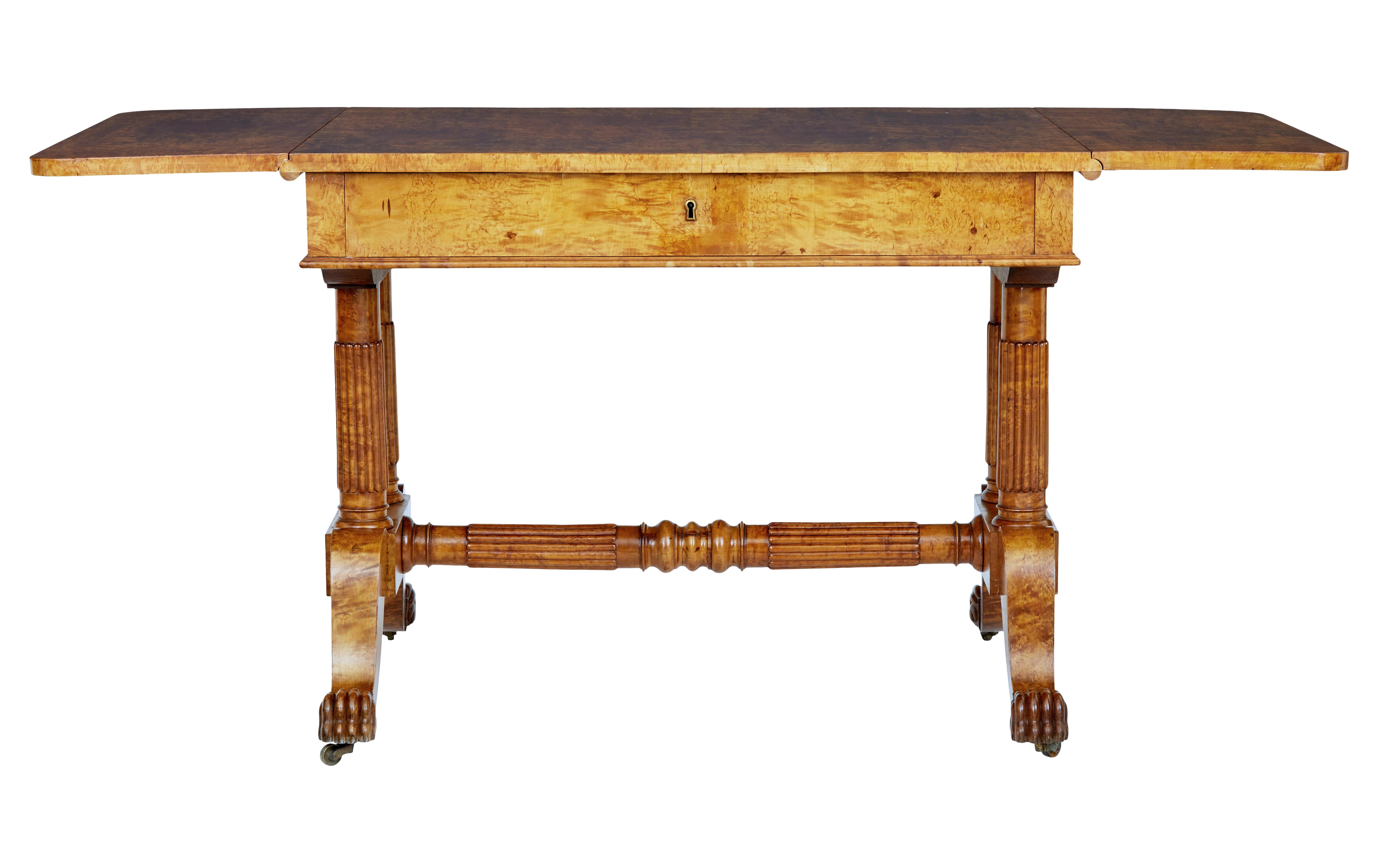 Superb quality Biedermeier period sofa table circa 1825.

Beautifully made from burr birch, giving it strong grains and colour. Drop down flaps provide a overall length of just over 63 inches.

Single deep drawer below the top surface. Standing