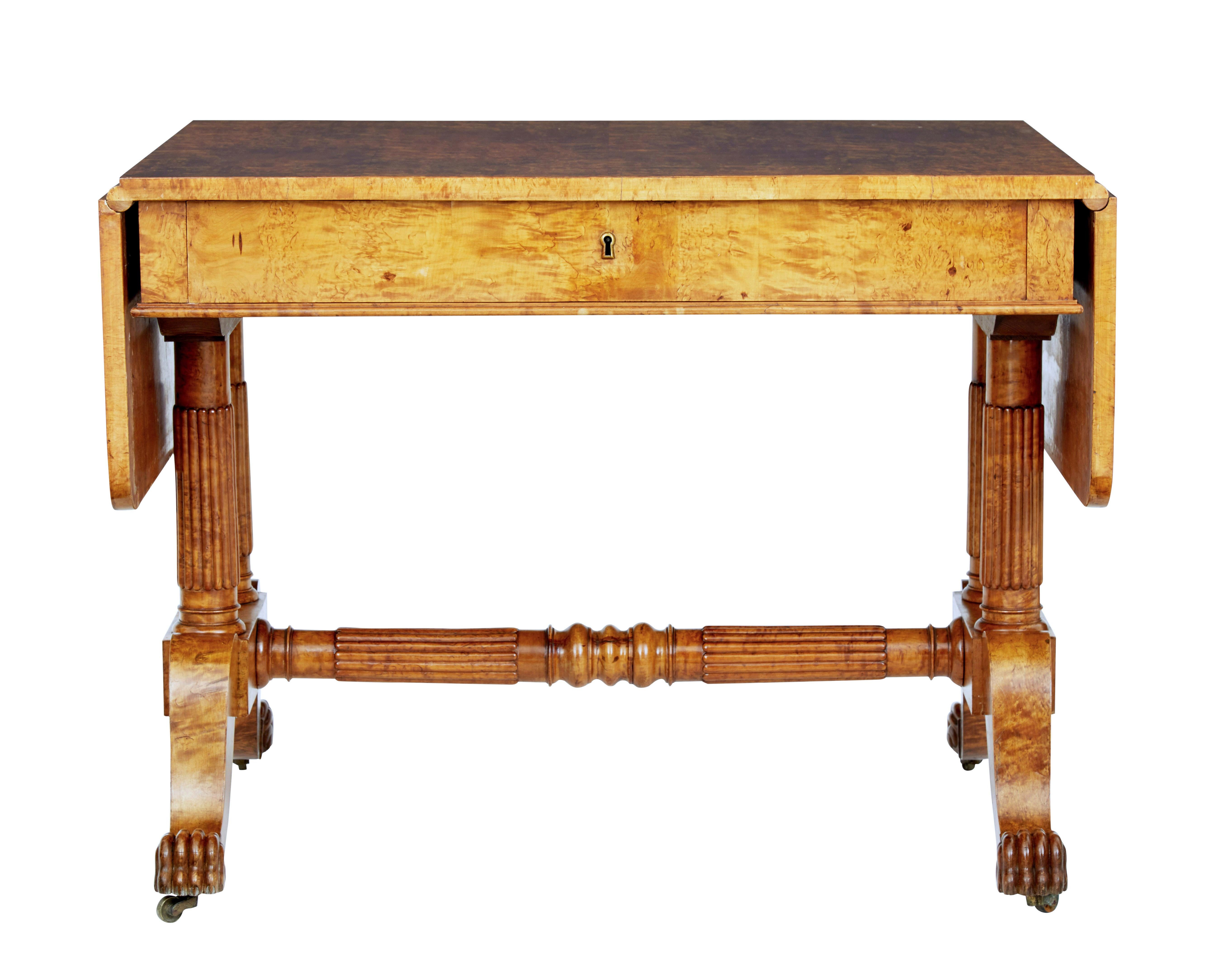 Superb quality biedermeier period sofa table circa 1825.

Beautifully made from burr birch, giving it strong grains and colour.  Drop down flaps provide a overall length of just over 63 inches.

Single deep drawer below the top surface.  Standing on