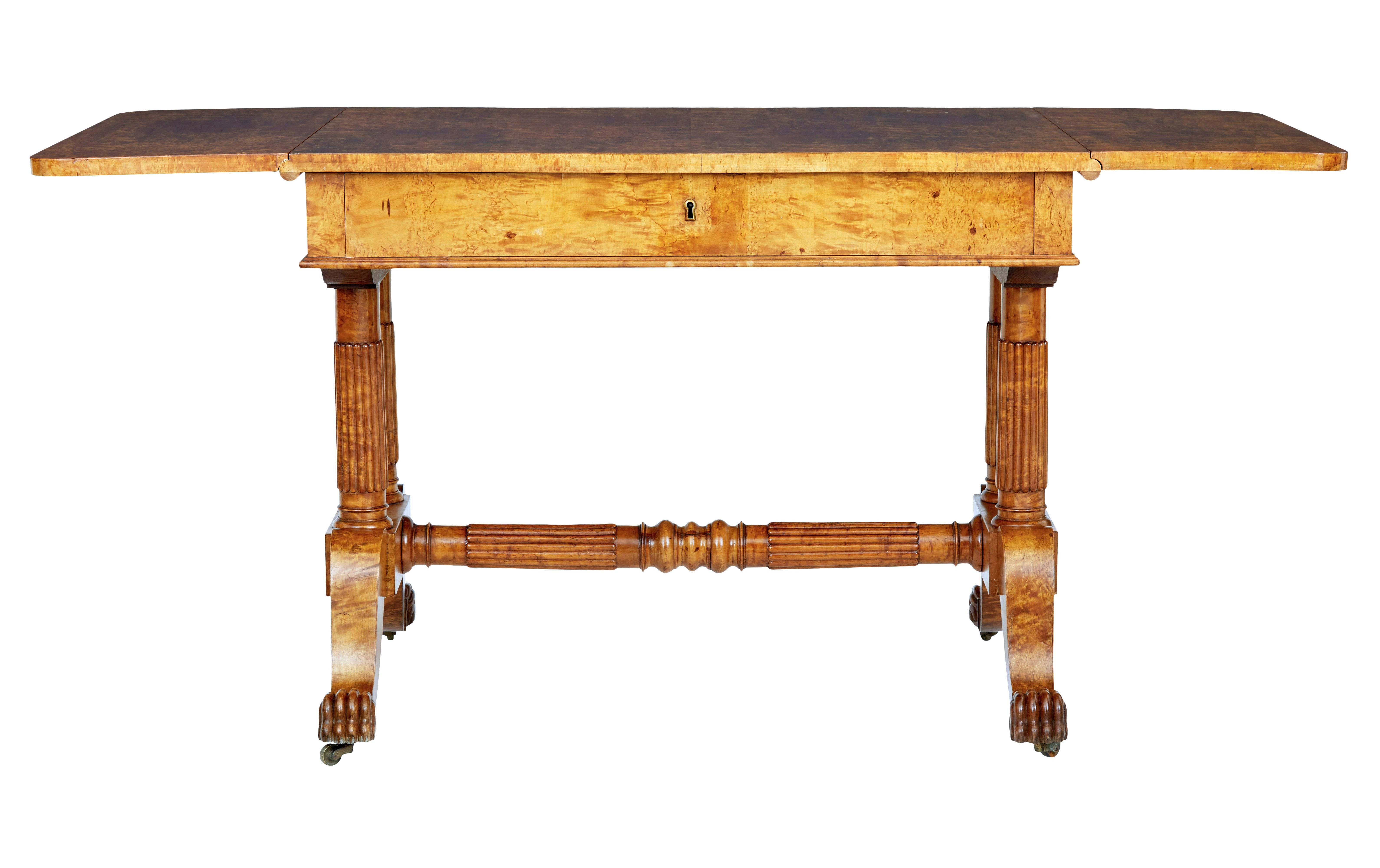 Superb quality Biedermeier period sofa table circa 1825.

Beautifully made from burr birch, giving it strong grains and colour.  Drop down flaps provide a overall length of just over 63 inches.

Single deep drawer below the top surface.  Standing on