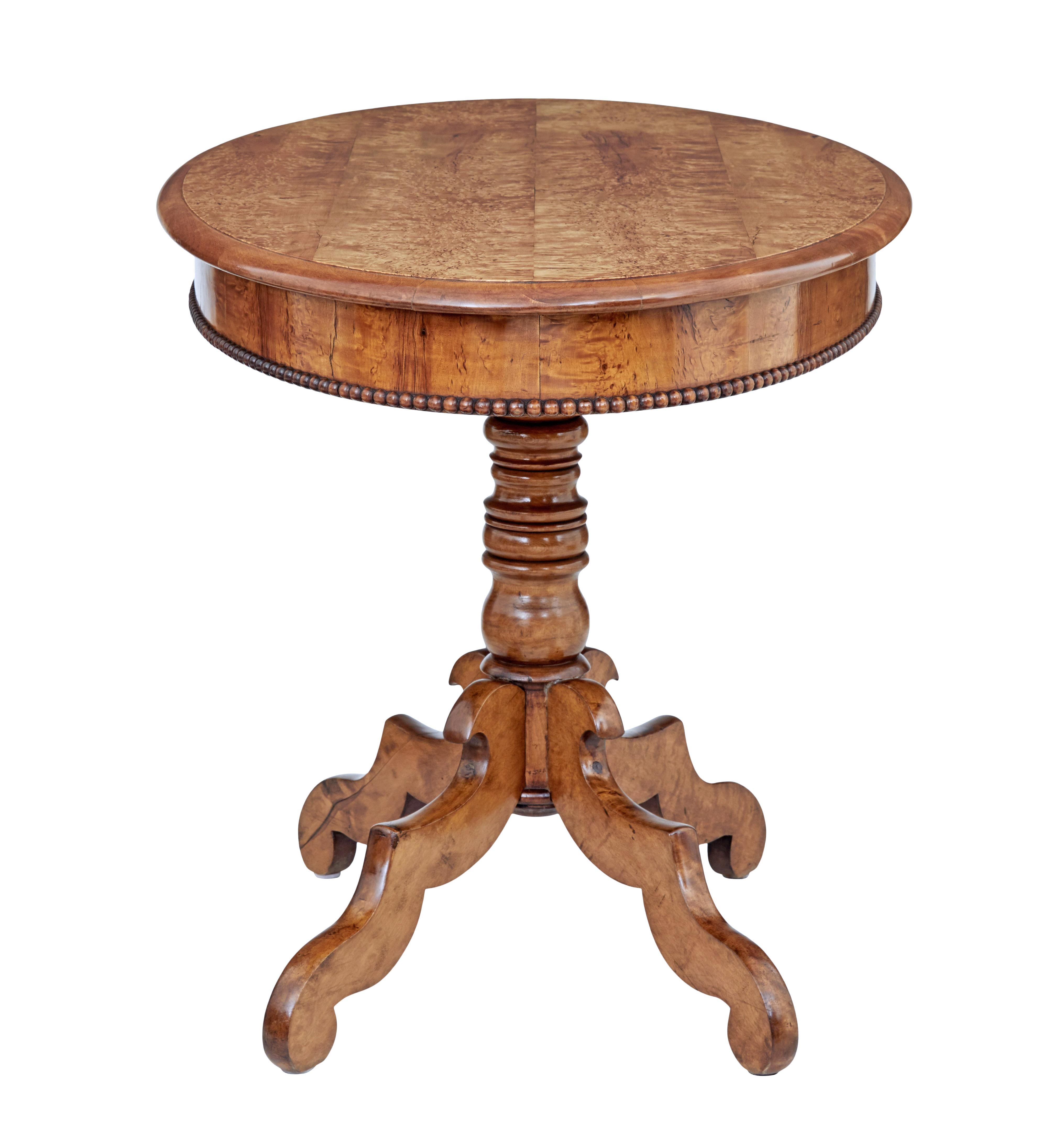 19th century burr birch oval occasional table, circa 1870.

Swedish burr birch table that has multiple uses due to its size. Beautiful burr birch top with rich golden color. Beaded edge detail to the apron. Standing on a turned column stem and