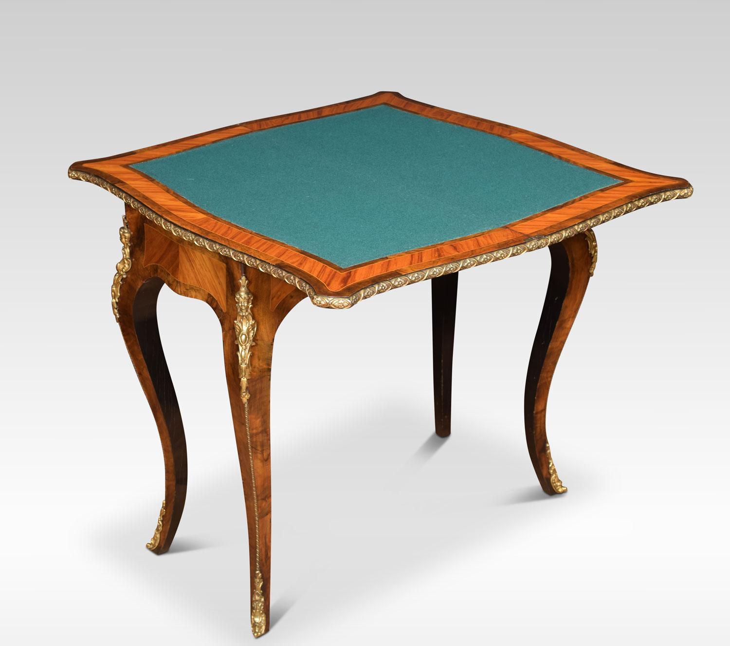 19th century burr walnut and kingwood card table, the serpentine inlaid floral top with bronze metal banded border opening to reveal baize interior and kingwood banded edge, all raised up on four slender cabriole supports, terminating in scrolling