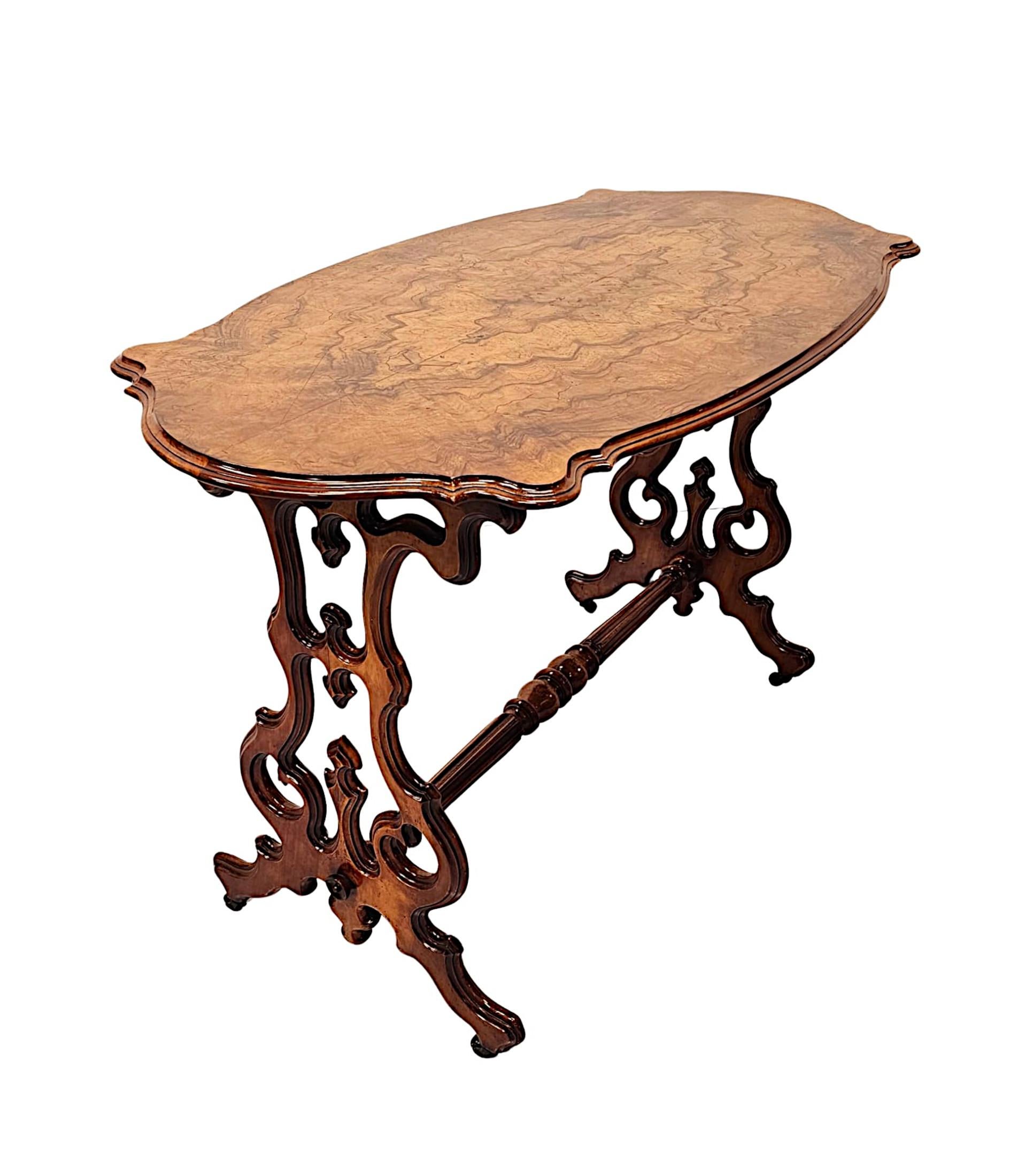 A very fine 19th Century beautifully patinated burr walnut centre or side table, superbly hand carved with fabulous grain and of exceptional quality.  The well figured and moulded serpentine top of rectangular form with roundel detail to the corners