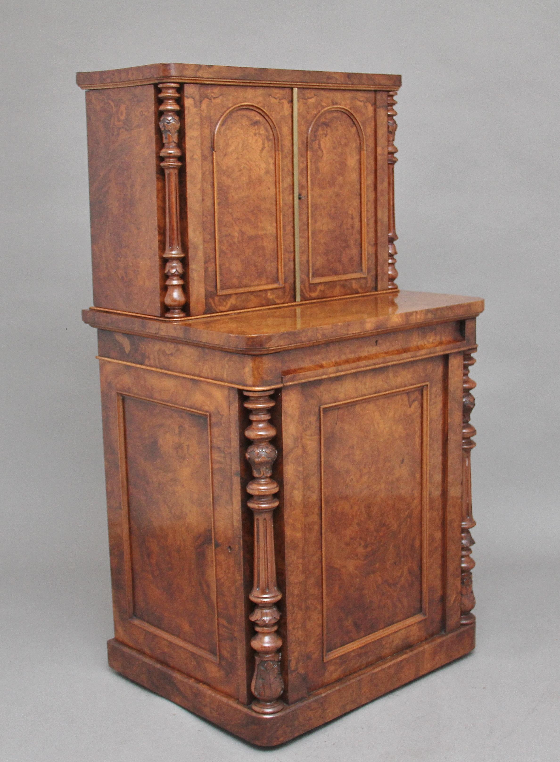 A superb quality mid-19th century freestanding burr walnut desk / cabinet, the top section having two arched paneled doors opening to reveal four drawers at the centre made out of sycamore, the drawer fronts having ebonized handles, four