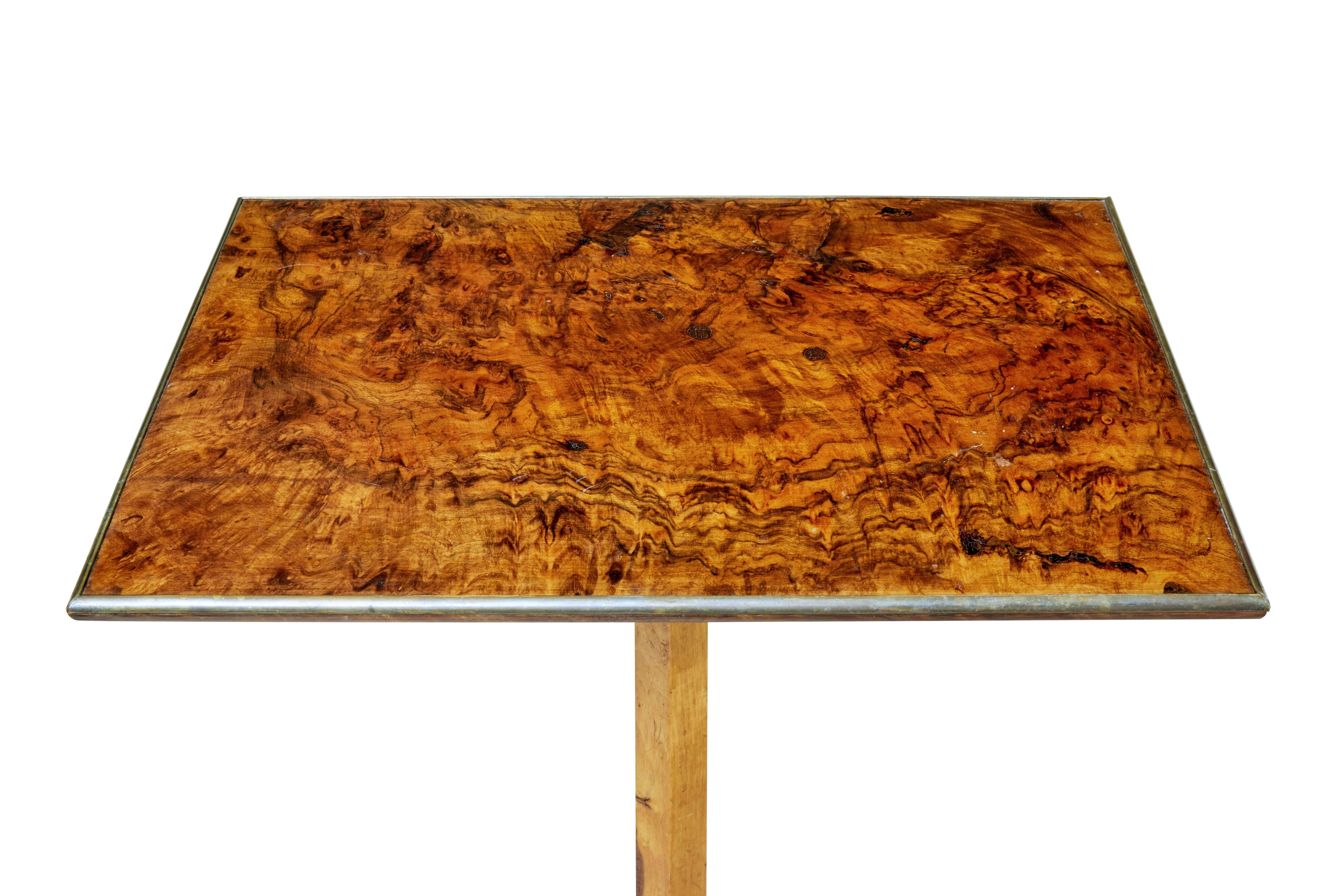 Beautiful quality Swedish burr occasional table, circa 1880.

Rectangular burr walnut top with brass edging. Standing on a birch tripod base and pad foot.

Multiple uses for this elegant piece, such as a lamp/side table.