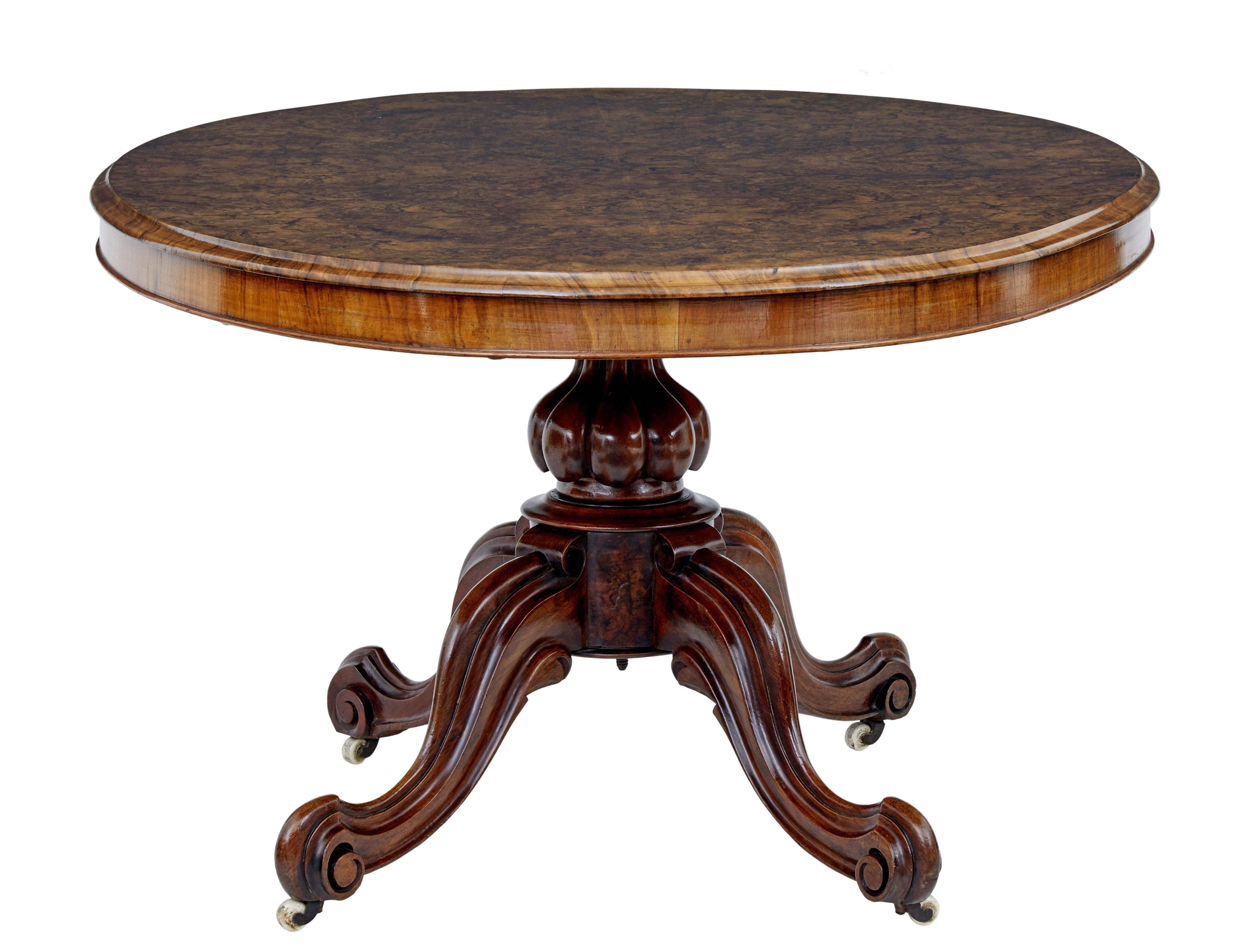 19th century High Victorian walnut breakfast table circa 1870.

Oval top with fine burr walnut veneer top. Standing on a bulbous stem and 4 scrolling legs fitted with castors.

Fitted with original tilt mechanism.

Ideal for use as a dining