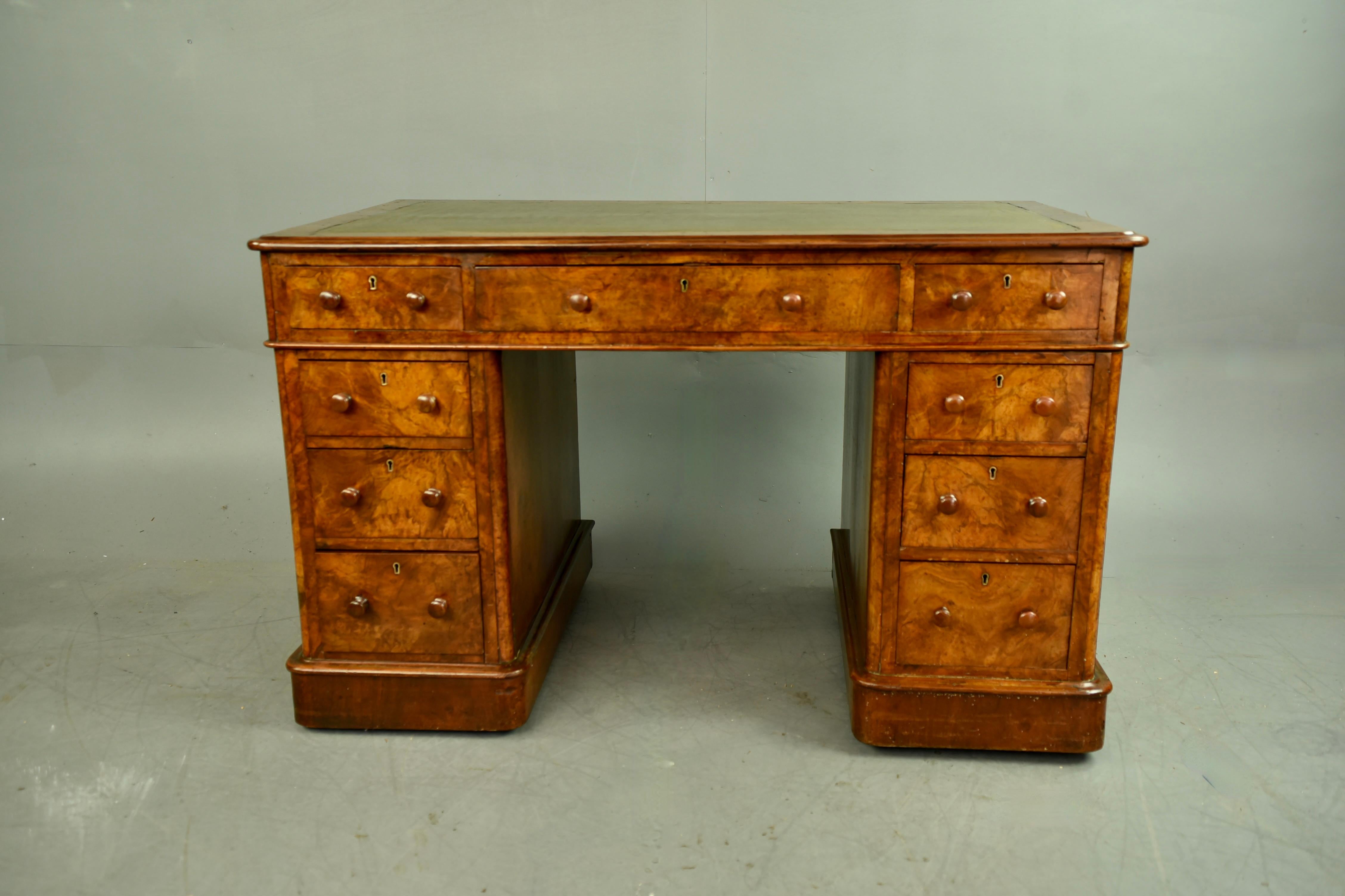 Fine quality mid Victorian twin pedestal desk circa 1860 .
The desk has a 9 drawer configuration consisting of three across the top and three graduating drawers to each pedestal . There is a single key supplied for the top three drawers . .
The desk