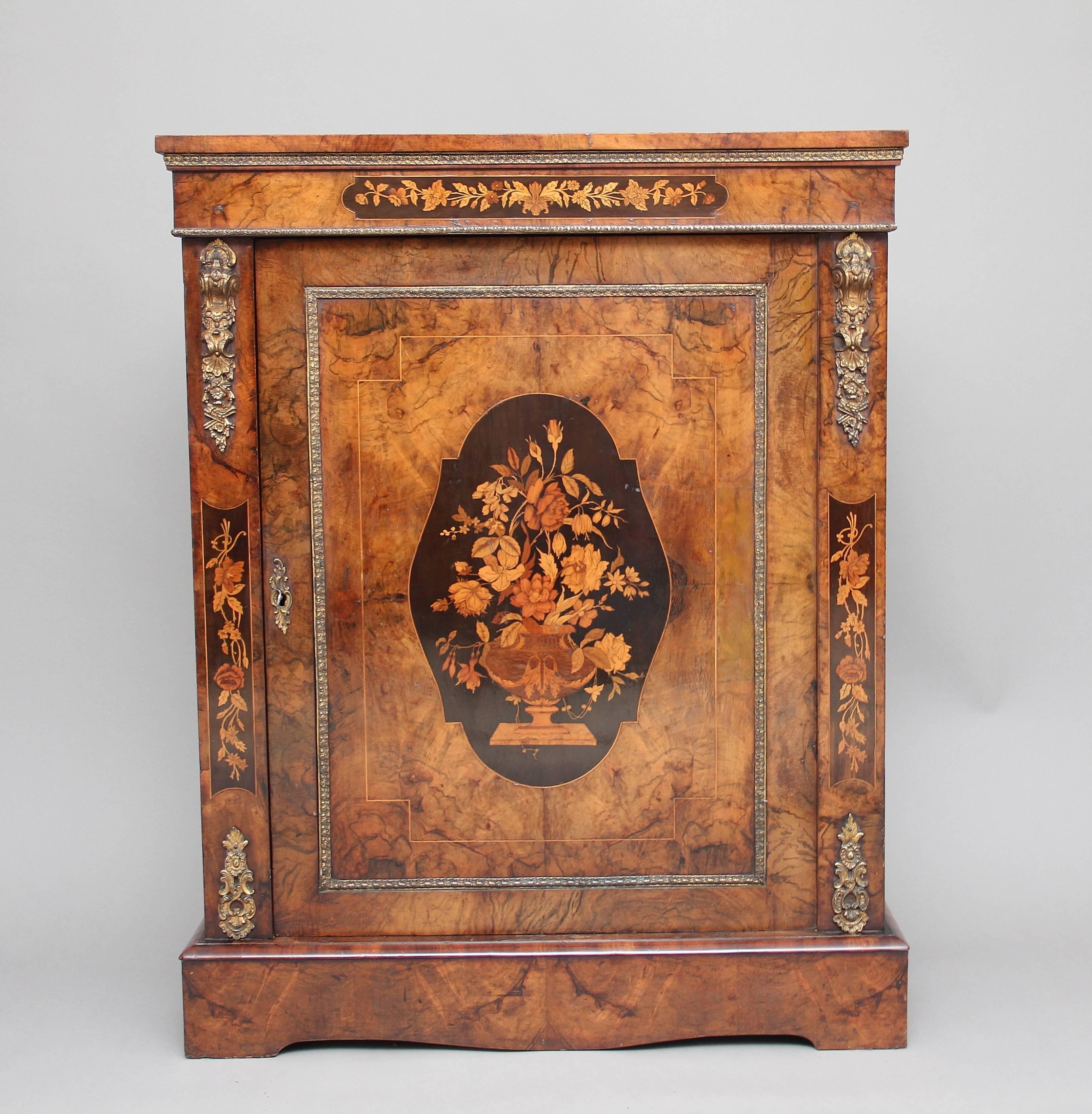 19th century burr walnut pier cabinet, superb quality burr walnut top above a frieze decorated with ormolu beading and an inlaid marquetry panel of floral design, the single door having a large inlaid marquetry panel at the centre with ormolu