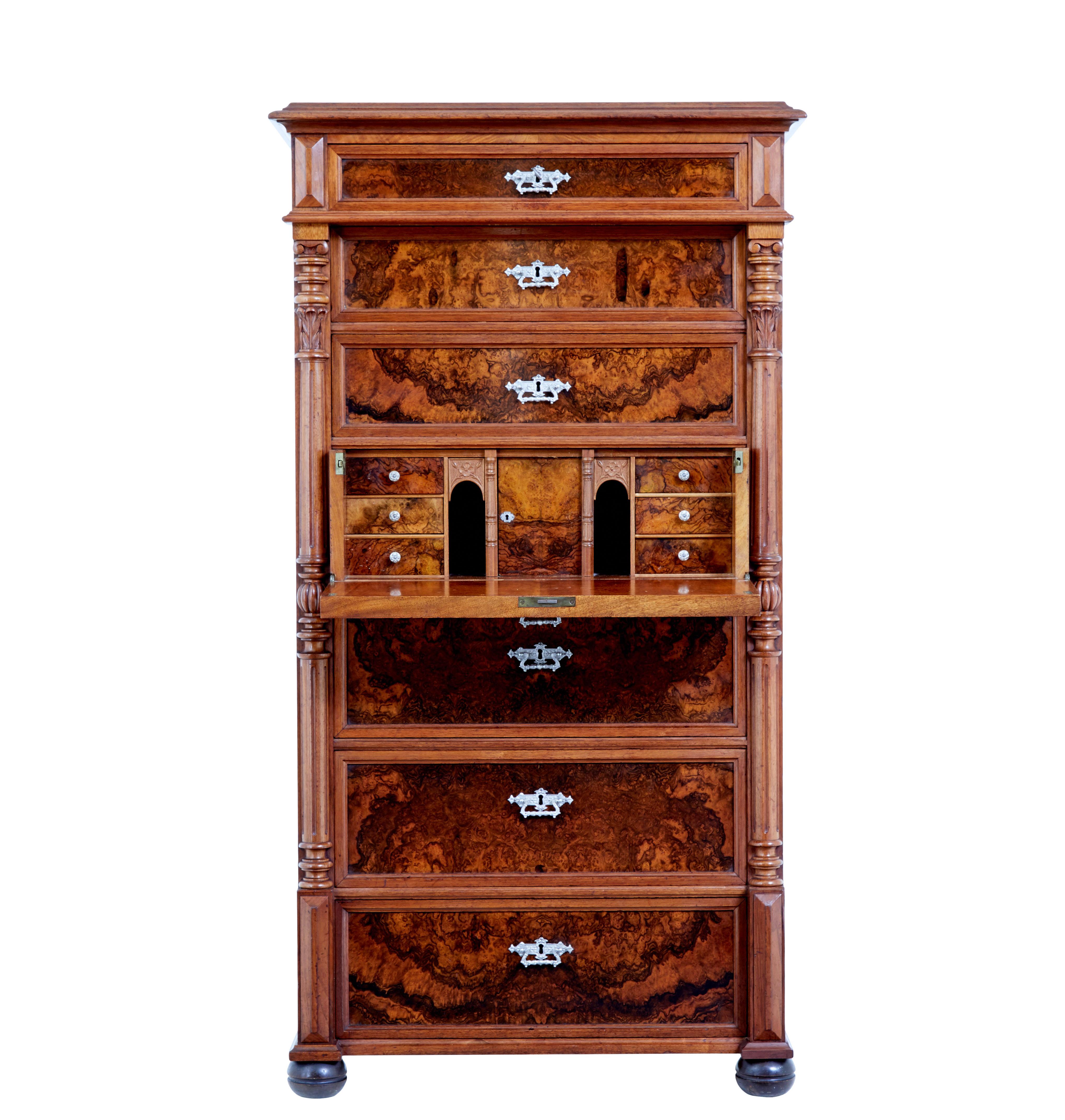19th century burr walnut secretaire tall chest of drawers circa 1890.

Striking walnut and burr walnut 7 drawer chest, which is often known as a seminere, albeit this one has the addition of a secretaire.

Top drawer slightly overhangs the other