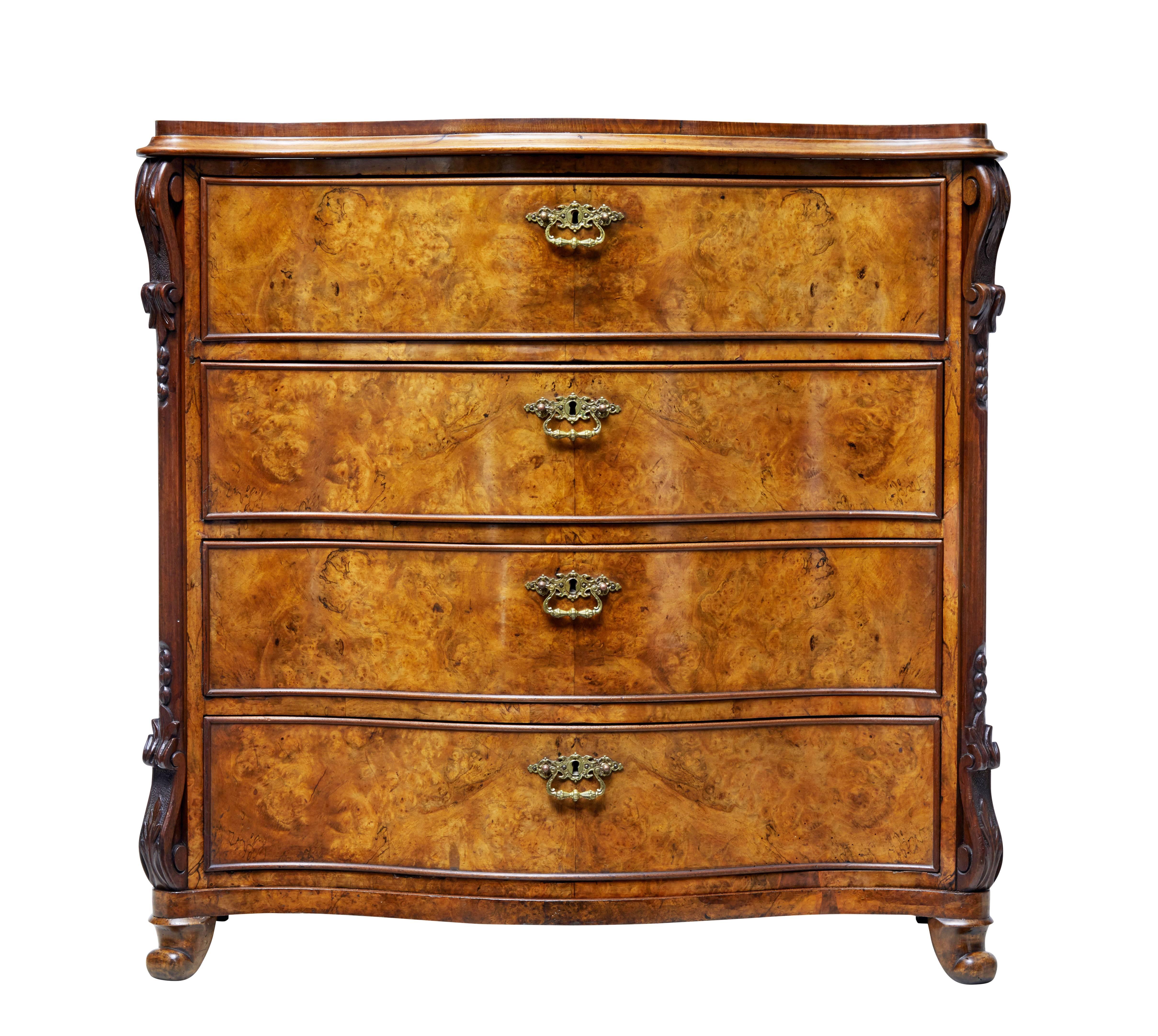 Fine mid-Victorian walnut chest of drawers, circa 1870.

Serpentine shaped front. Four drawers with beaded edging and central ornate handle. Top drawer fitted with slide compartments.

Carved decorative scrolls to the canted corners.

Good