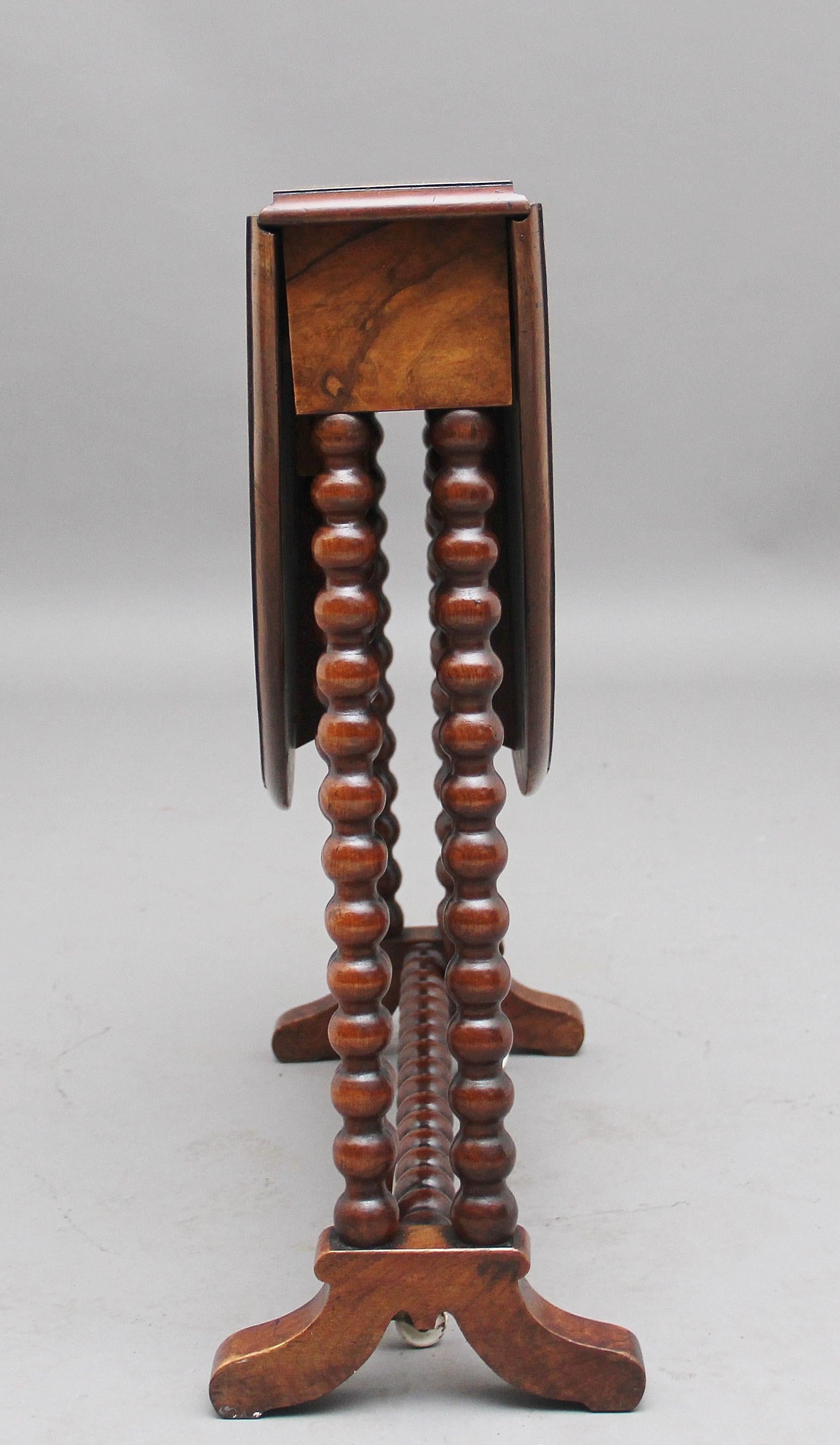 19th century burr walnut Sutherland table of small proportions, the oval quarter veneered top with a moulded edge raised on bobbin turned supports, standing on shaped feet. The table is in very good condition and has a lovely burr walnut figured