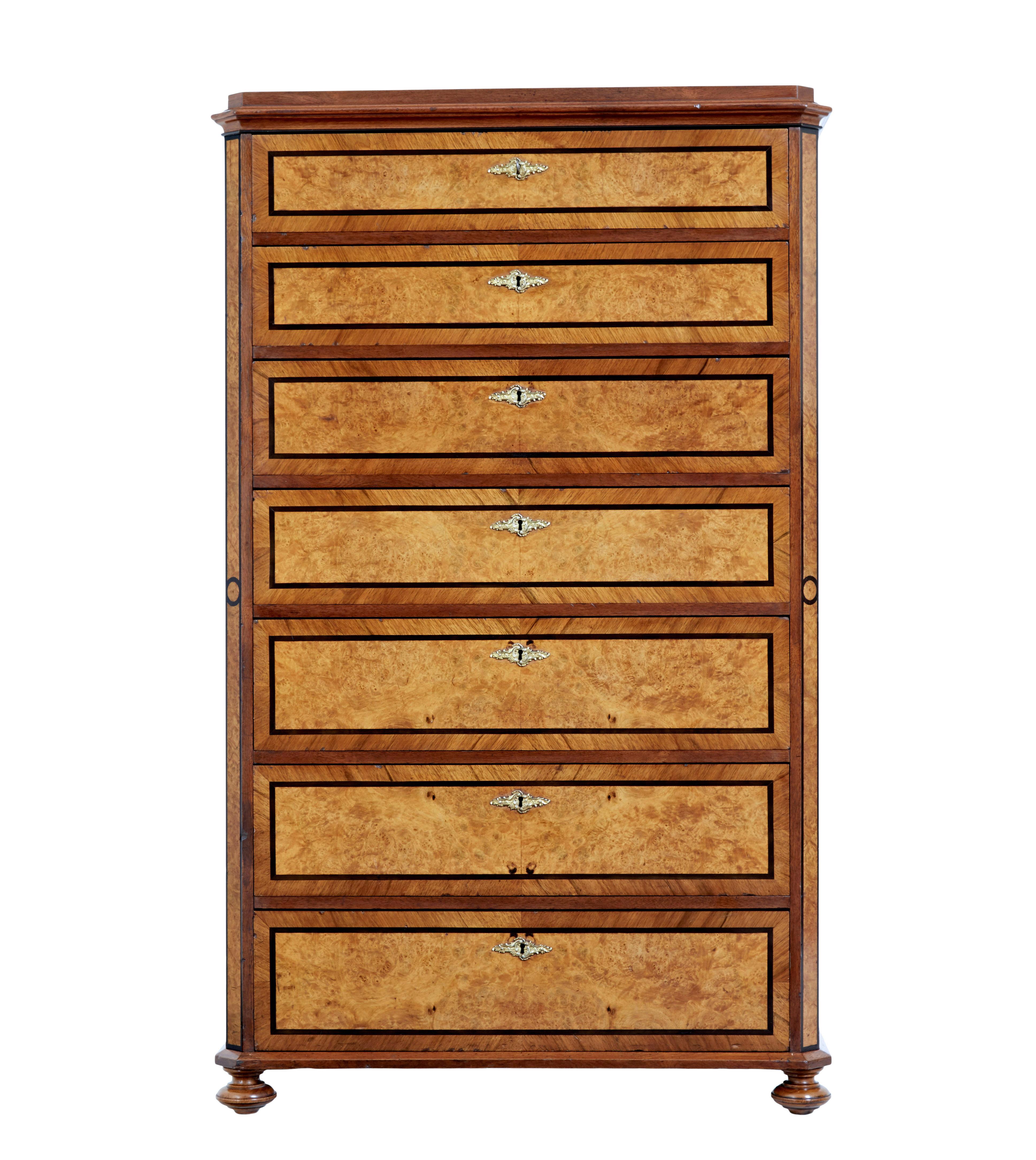 19th century burr walnut tall chest of drawers circa 1880.

Great quality tall chest of drawers often known as a seminere chest as it has 7 drawers.

Shaped walnut top surface with matching coloured sides which provide a delightful contrast to the
