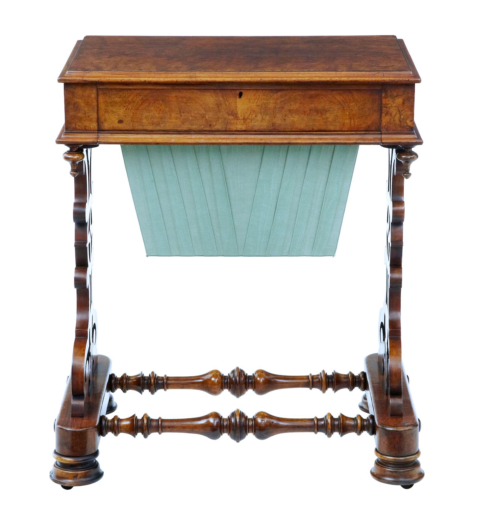 19th century burr walnut work occasional table circa 1870.

High Victorian ladies work table.
Beautiful walnut work table of good color and patina.
Satinwood interior with fretwork covered compartments.
The interior is echoed by the fretwork