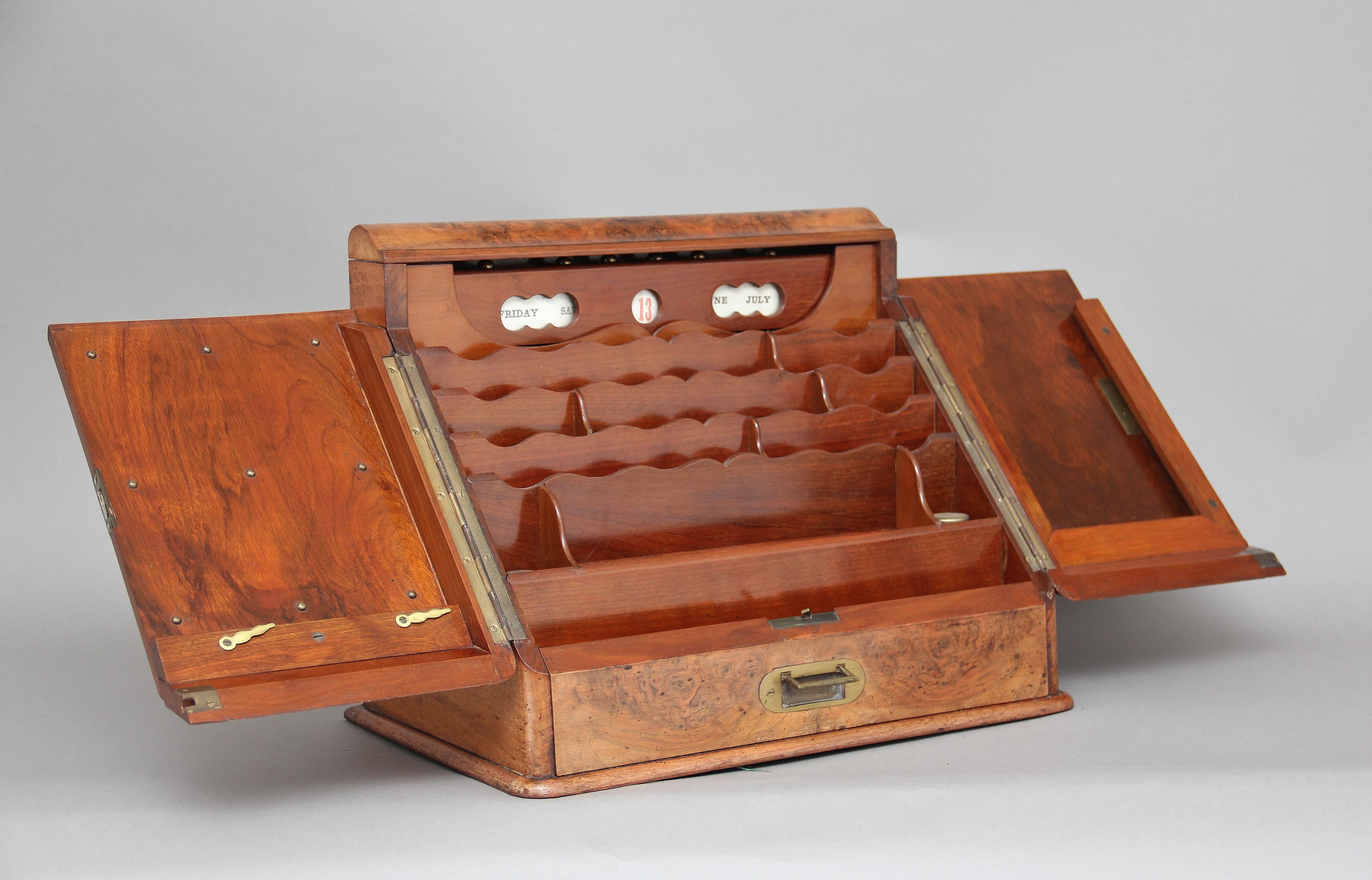 19th century burr walnut writing slope or box, when opened there are various compartments, a pen tray, two ink wells and a calendar, there is also a drawer in the frieze. Lovely quality, circa 1870.
    