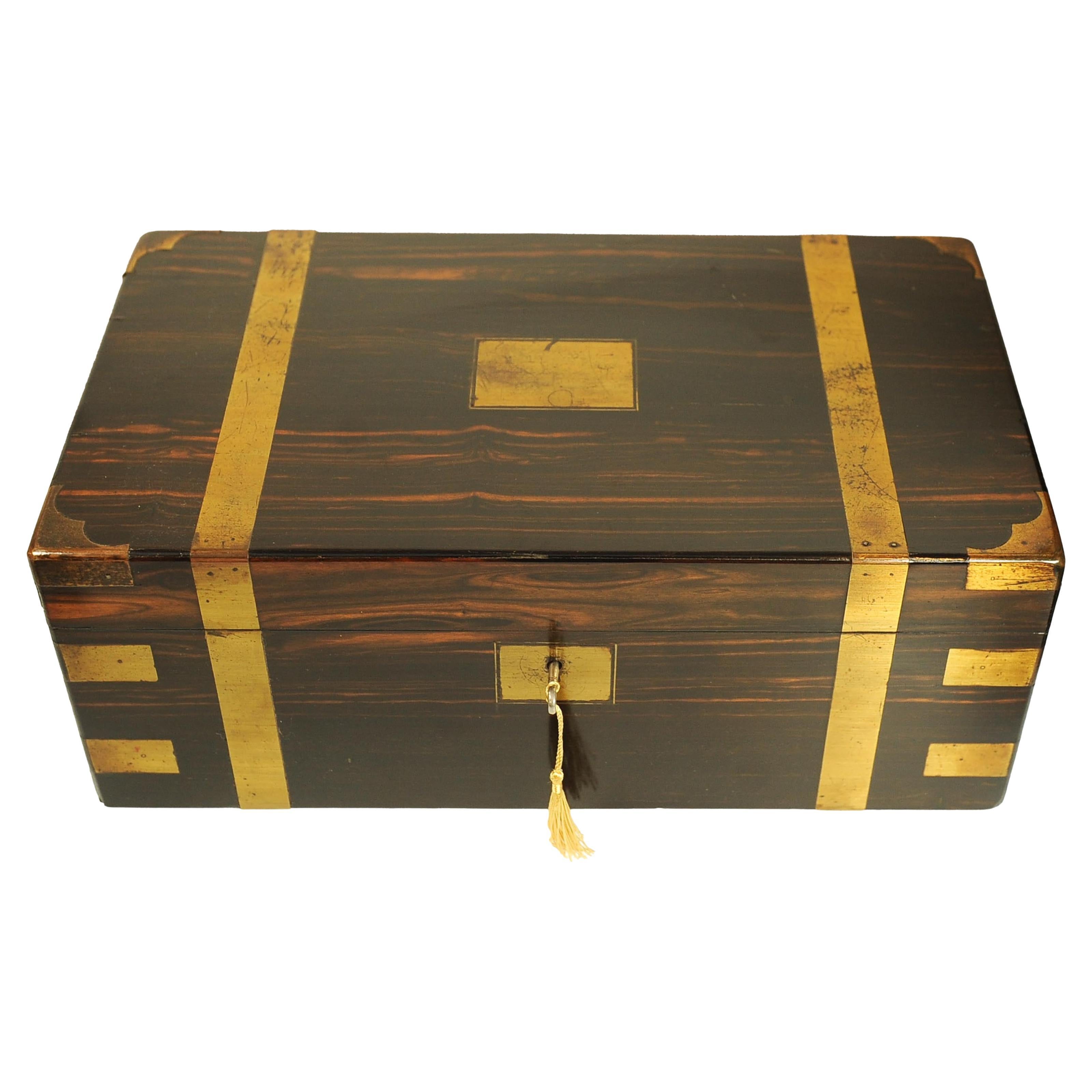 Beautiful Late 19th Century Campaign Brass Bound Coromandel Writing Slope With Black Tooled Stylish Inlay Throughout.
With A Secret Compartment

The slope features a well executed fitted interior.

Interior when folded out, is finished with a black