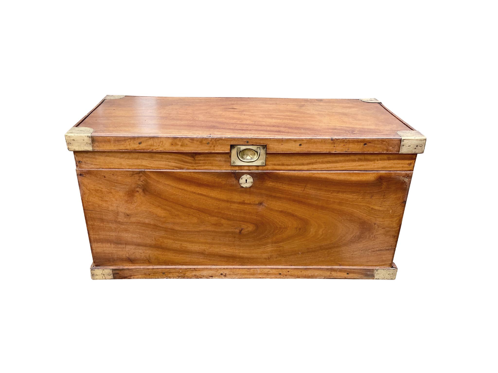 19th Century chest hand-crafted from camphor wood with beautiful brass trimming and iron handles. We love the wood's amber-orange tone and organic wear, which gives the chest its character and warmth. 


Dimensions: 
41 in. width
21 in.