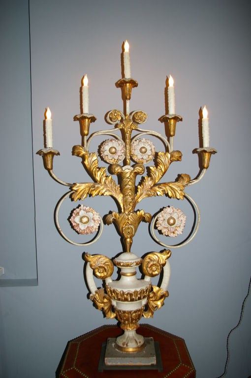 19th century gold leaf elements mounted on a base. This one of a kind large scale table lamp brings a bit of history into your home. Elegant, stylize and classical element. This ornate candleholder has been wired and mounted on a oil rubbed bronze