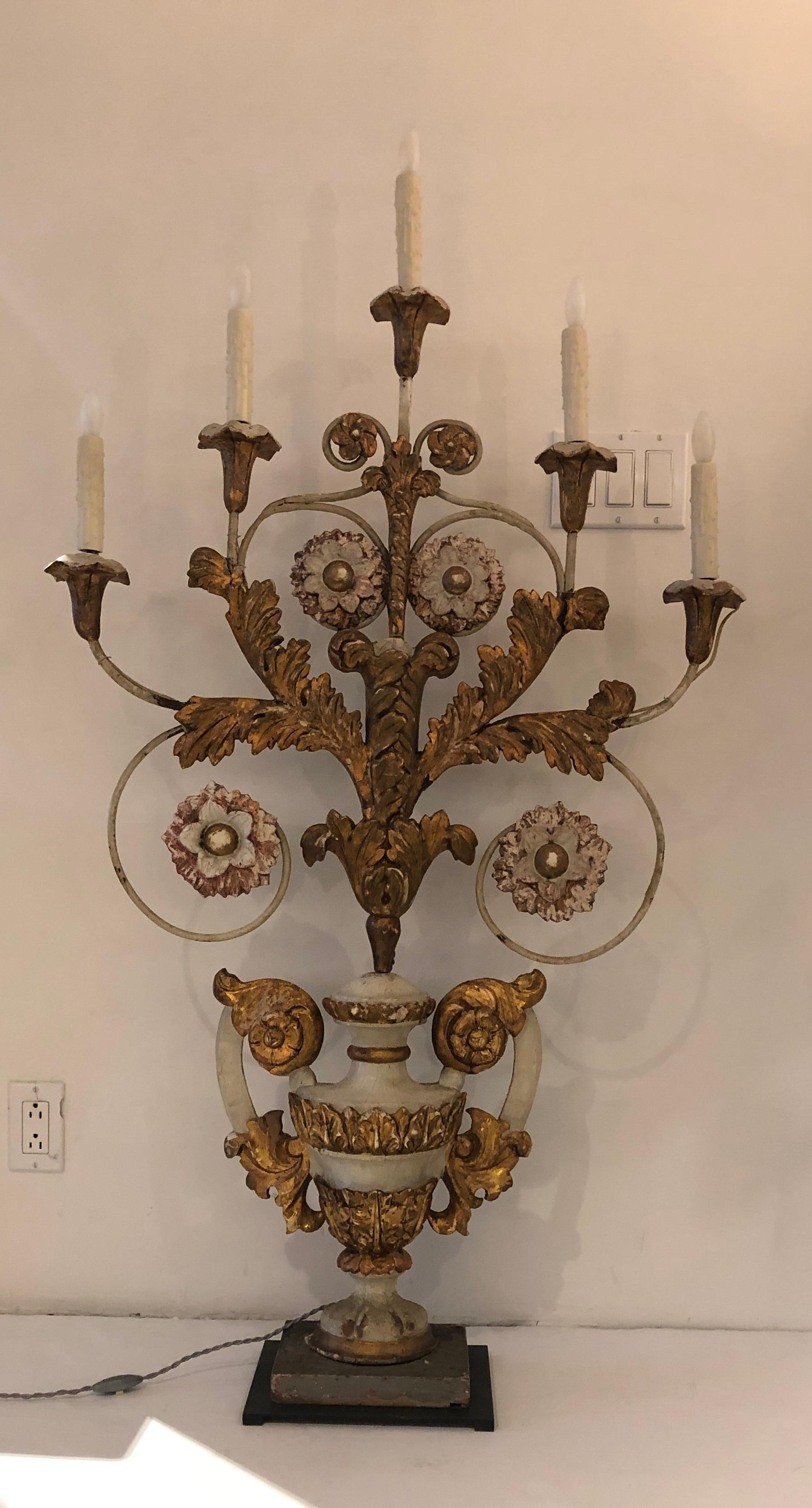 A one-of-a-kind statement piece, this large-scale table lamp seamlessly blends history with elegance. Featuring 19th-century gold leaf elements mounted on an oil-rubbed bronze base, it exudes classical sophistication. Originally an ornate