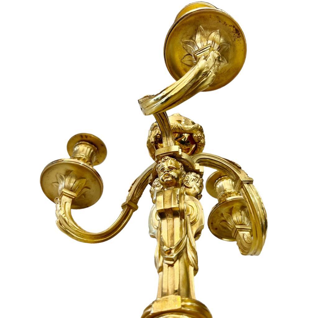 19th Century Candlesticks in Gilt Bronze with Three Lights and Putti Motifs 1