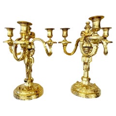 19th Century Candlesticks in Gilt Bronze with Three Lights and Putti Motifs