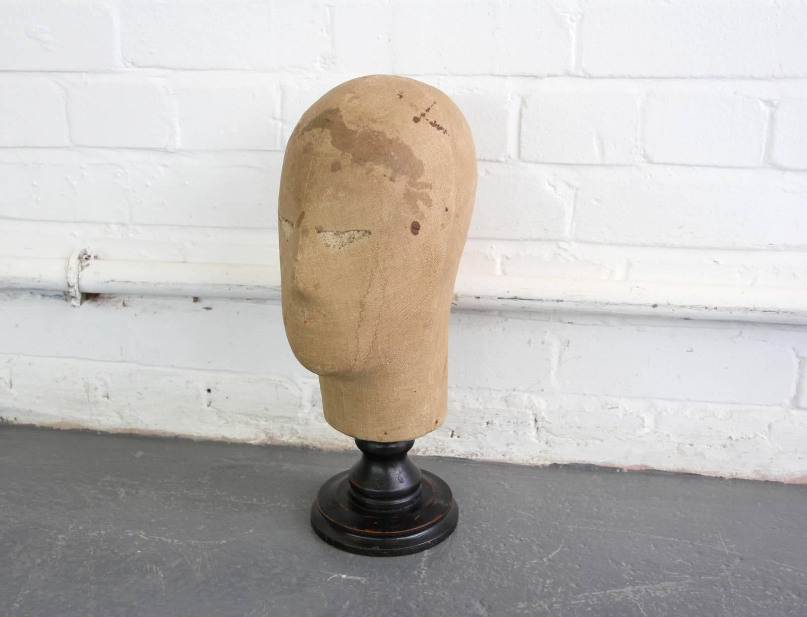 19th century canvas wig stand with ebonized base

- All prices inc VAT
- Canvas head
- Turned ebonised base
- English, circa 1870s
- Measures: 40 cm tall x 15 cm wide x 19 cm deep

Condition report

Various age marks on the canvas and