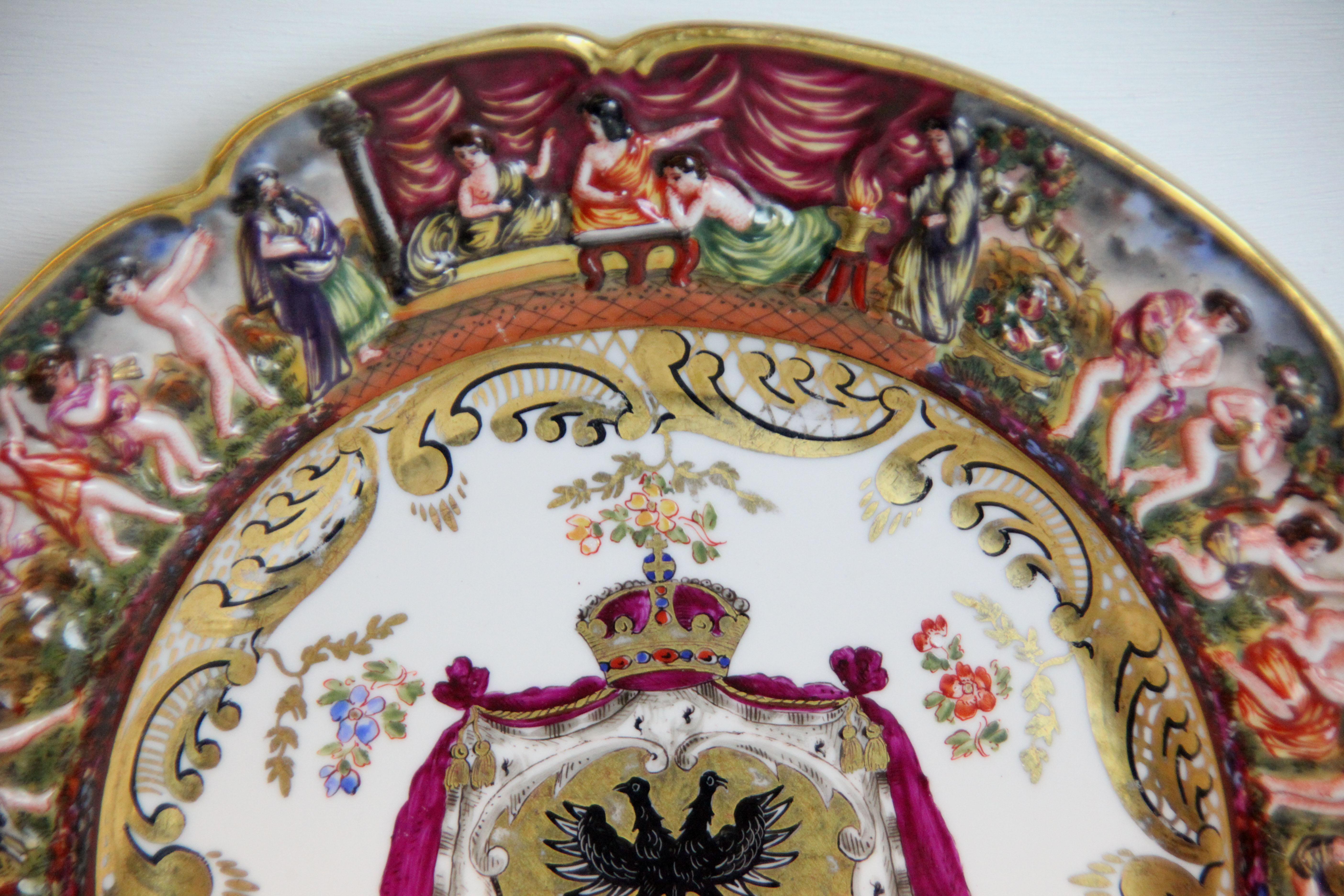 19th century Capodimonte plate, with shaped rim, border featuring classical scenes, the center with coat of arms.