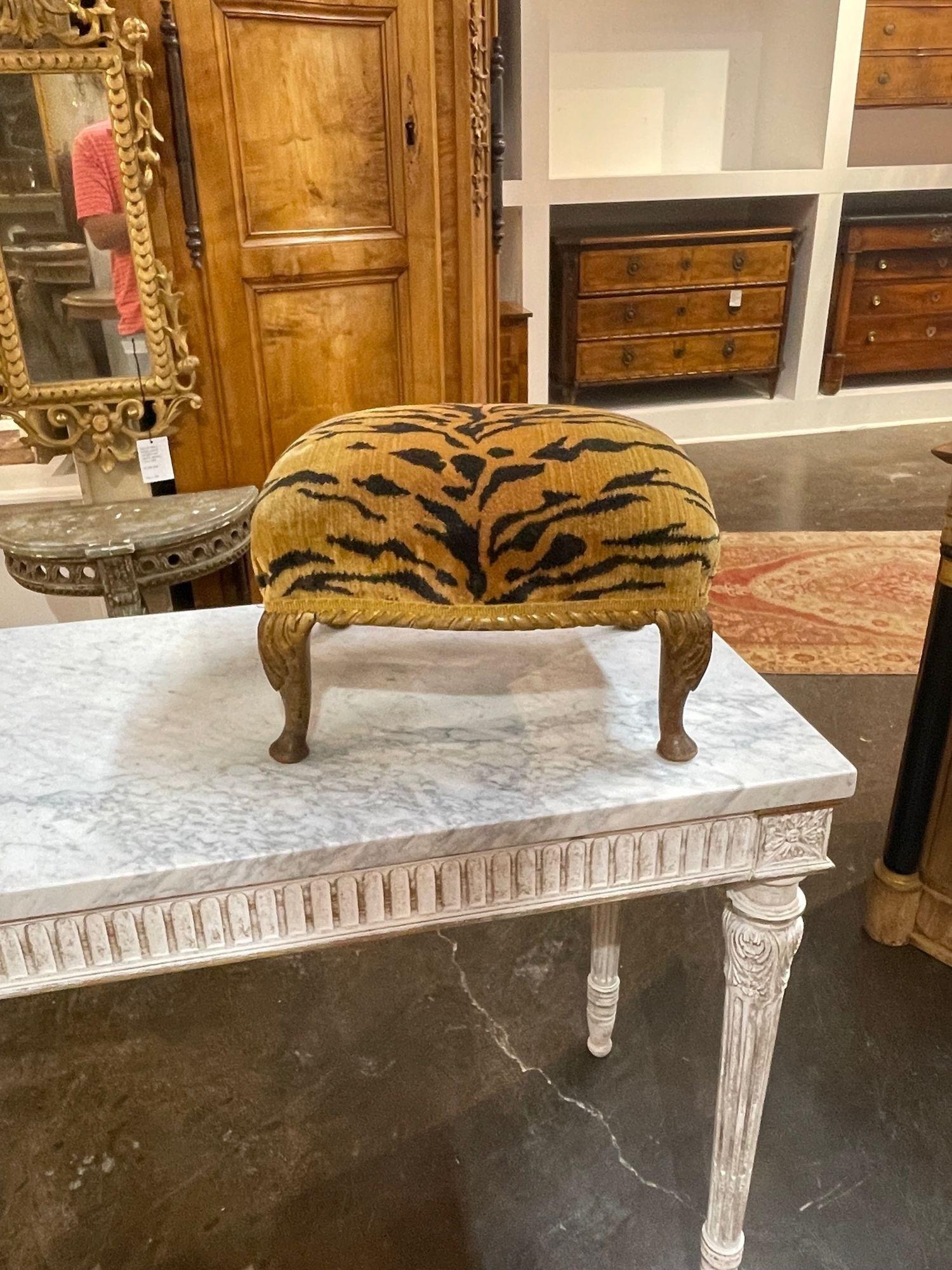Stylish 19th century carved and gilt wood stool with Scalamandre tiger upholstery. The piece has nice carvings as well. Makes a fabulous accessory!