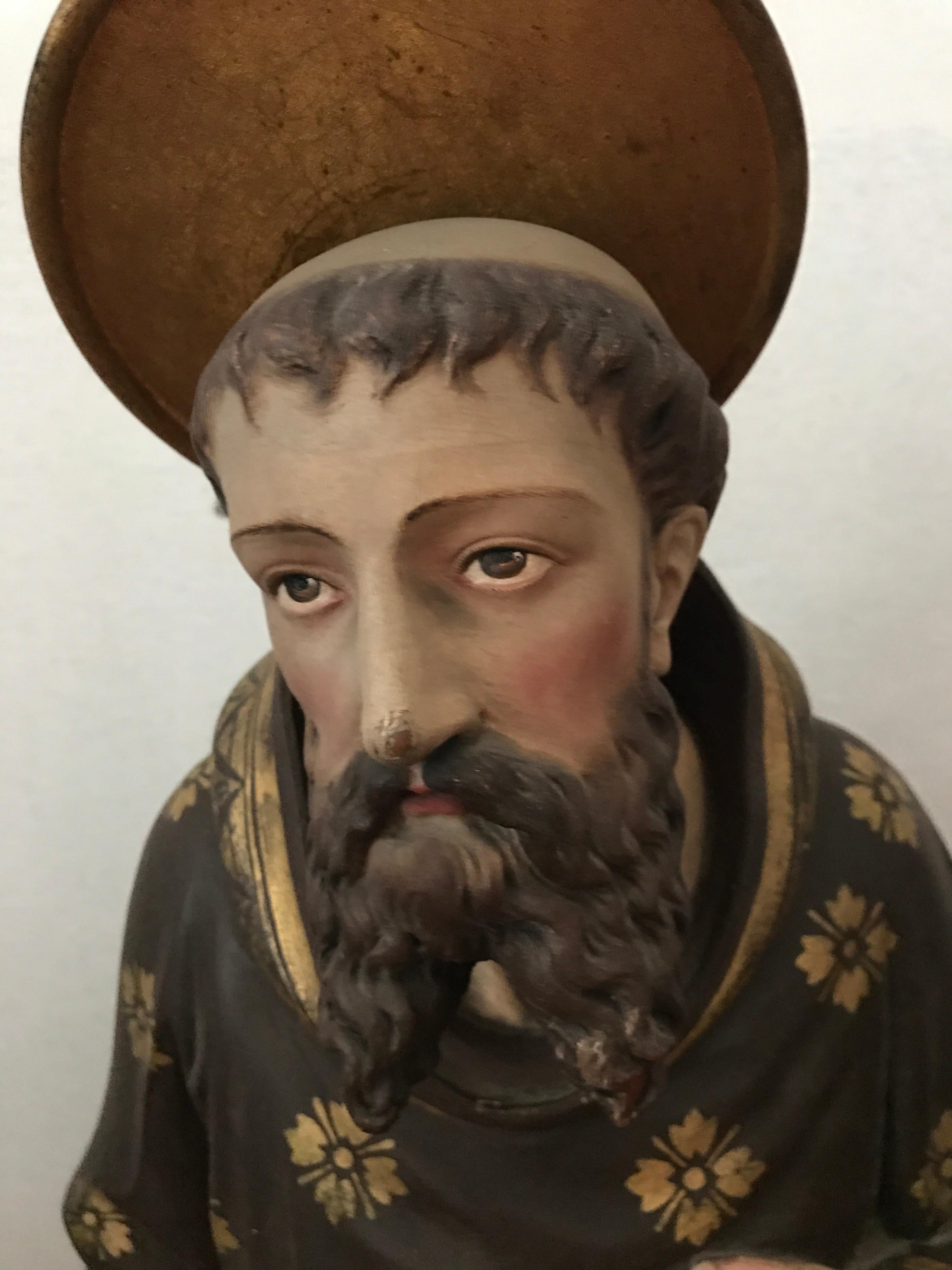 Fully hand carved wood statue of Saint Peter is in remarkably good condition retaining its original paint due to it being in the original placement of the Ava Marie Maricolen Cloister church until today. 
The church was built in Antwerp in 1860 for