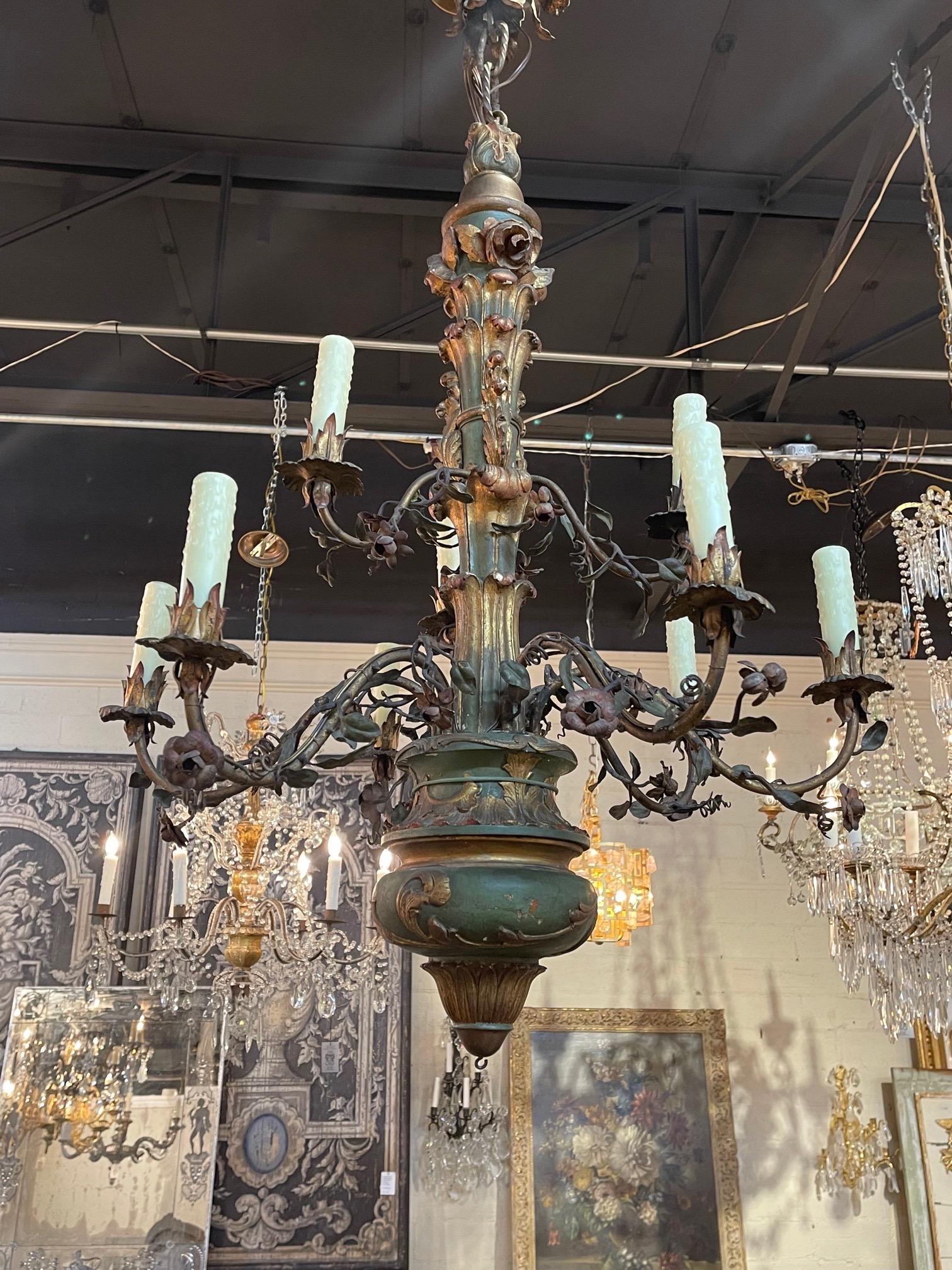 Very fine 19th century carved and painted Italian 9 light chandelier. Nice carving on this fixture and it is painted in gold and green. So pretty!