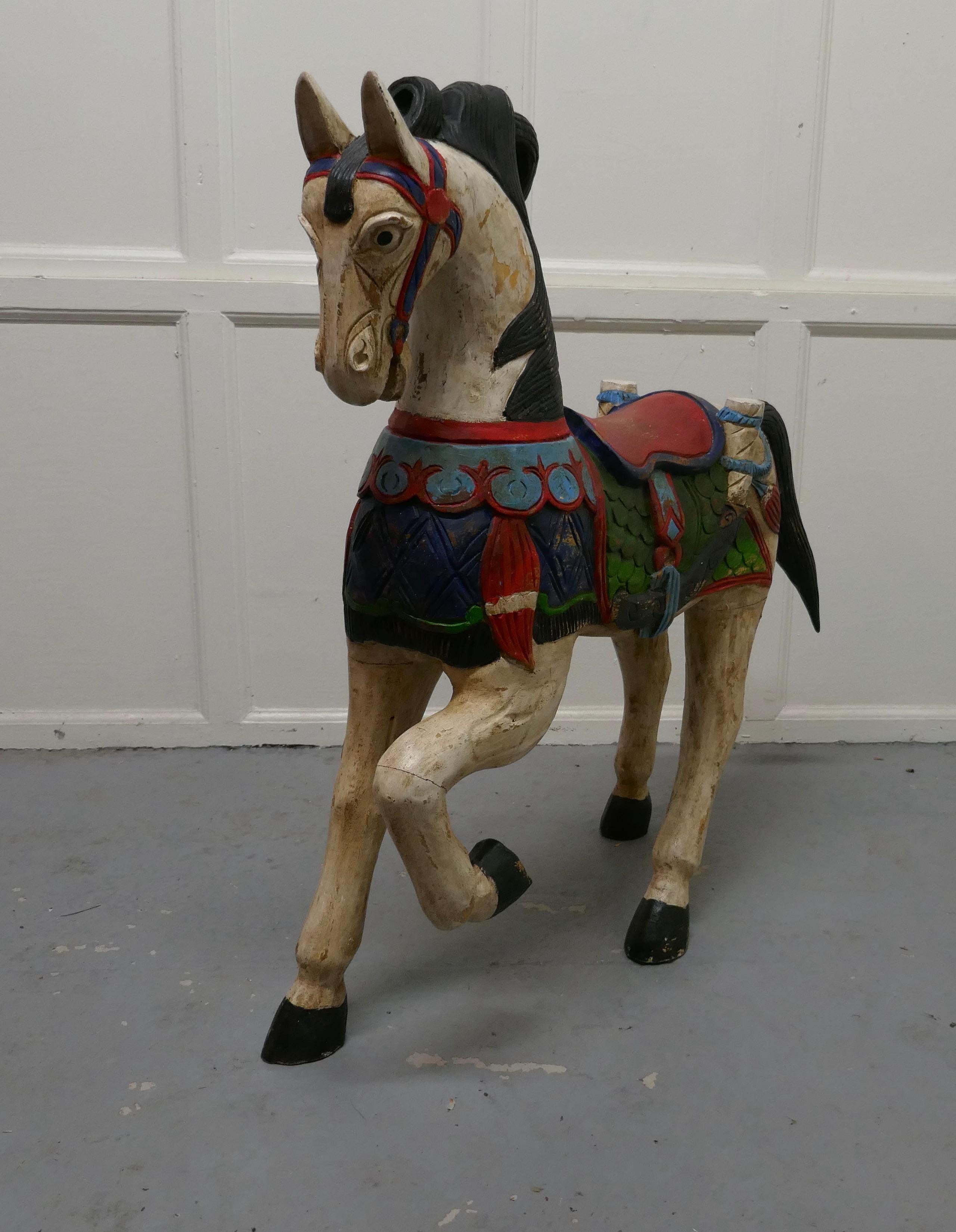 19th century carved and painted wooden horse

This is a superb piece of Folk Art, superbly carved in wood, the paint is original, it is quite bright if a bit shabby
The horse is in sound and though he has had a few knocks as you might expect
Our