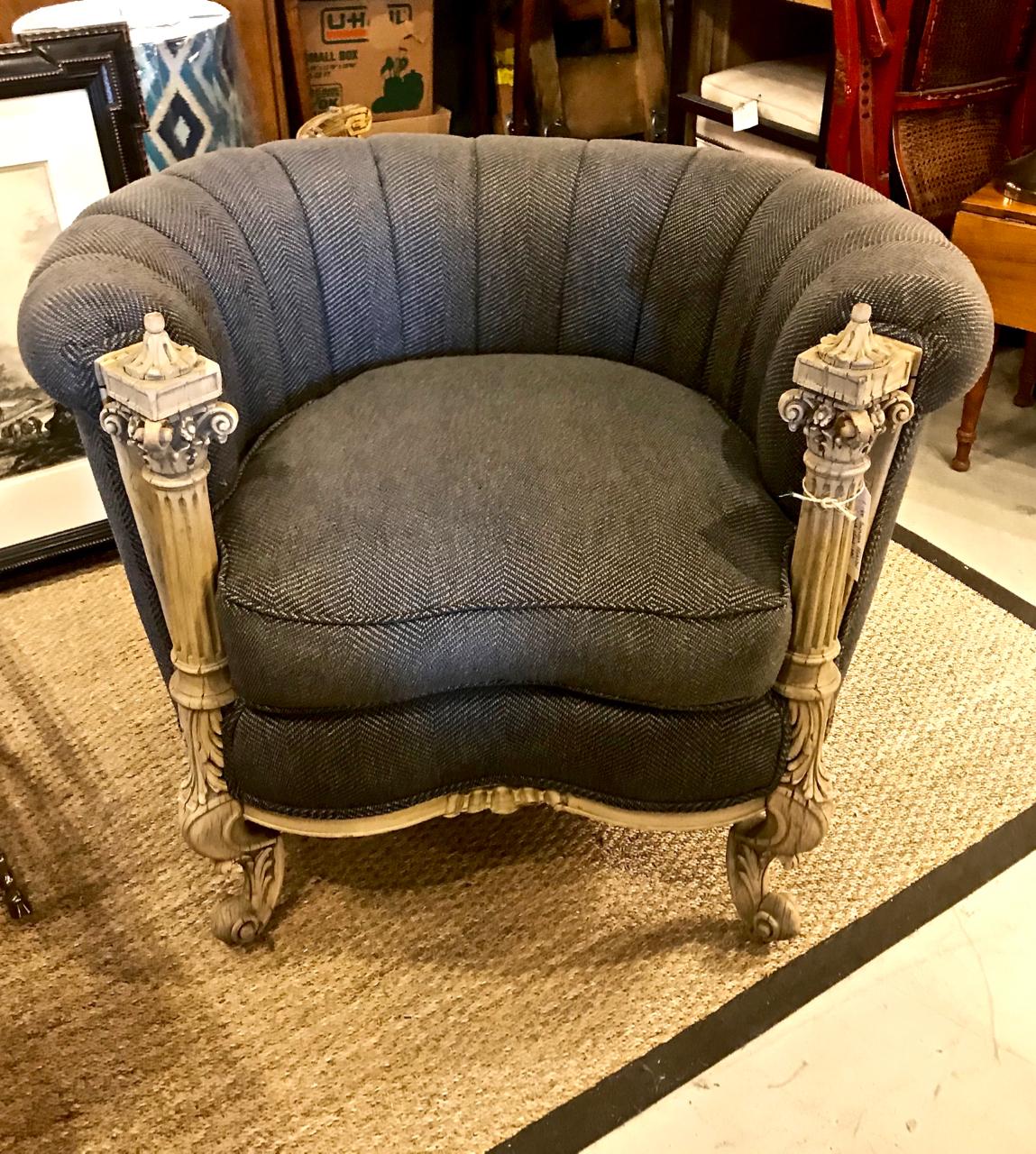 This is a unique late 19th-early 20th century carved mahogany barrel-back chair that is newly upholstered in a Kravet herringbone tweed. The springs have been retied; the channeling and cushion are down-filled. The Corinthian Column meets